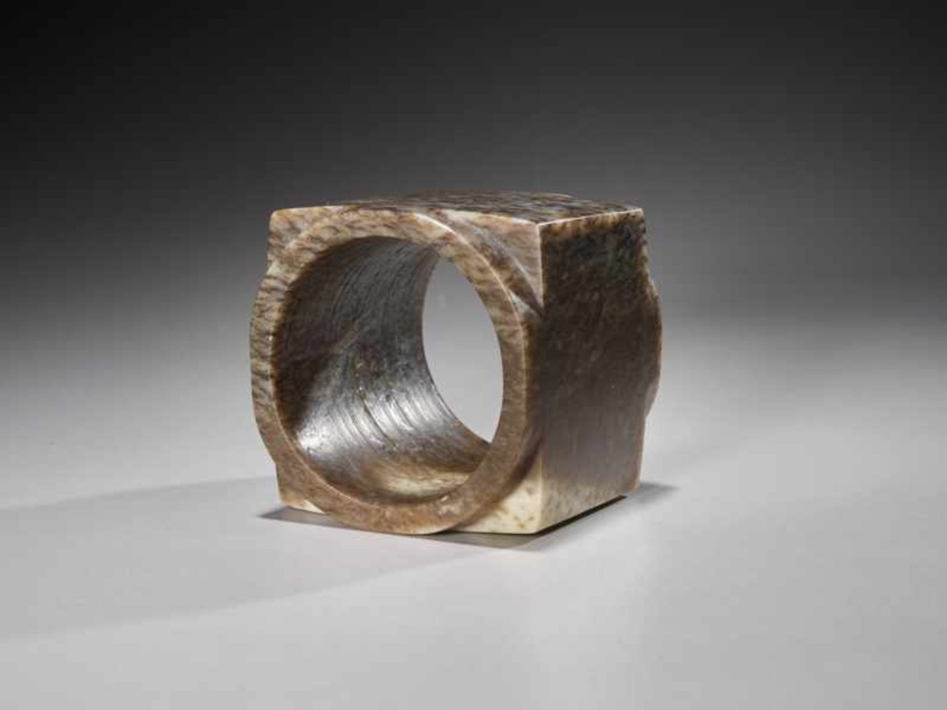 A SUPERB CUBE-SHAPED CONG WITH FINELY POLISHED SIDES CARVED FROM MOTTLED BROWN JADE Jade. China, - Image 6 of 6