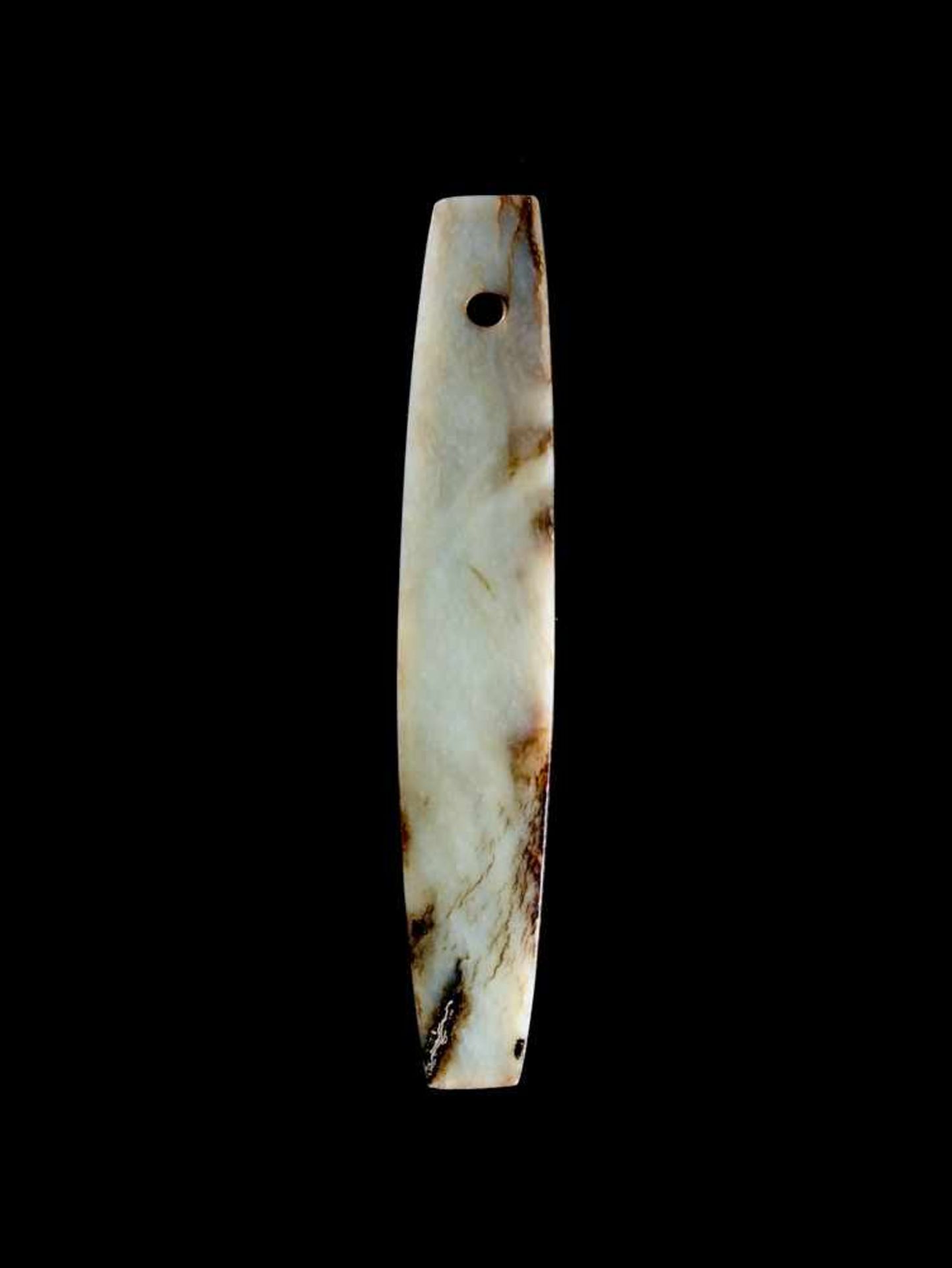 A FASCINATING AND RARE BLACK AND WHITE SLENDER BEN ADZE Jade. China, Early Bronze Age, Qijia