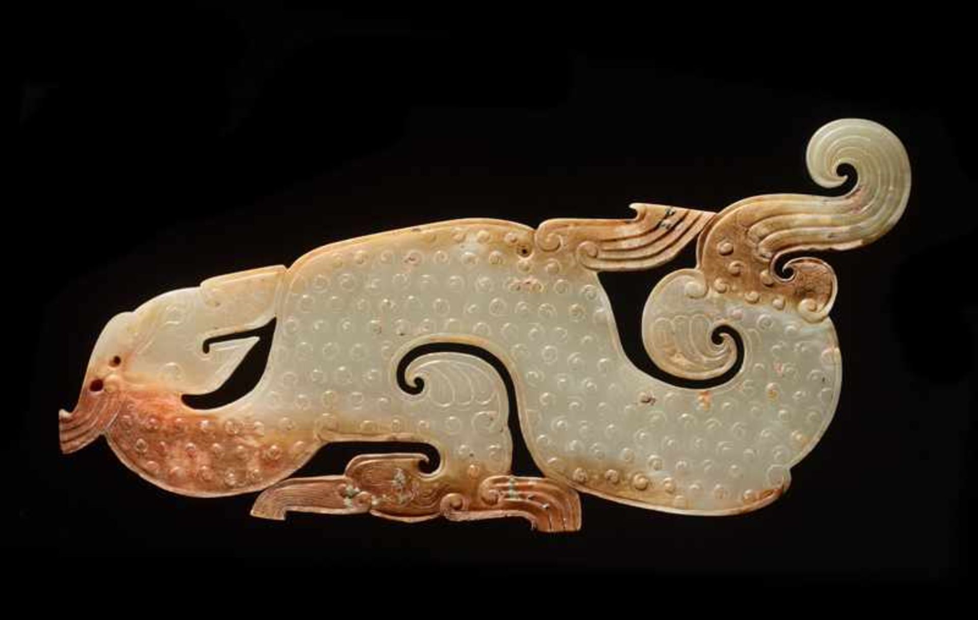 A SUPERB AND EXTREMELY RARE LARGE DRAGON-SHAPED PLAQUE CARVED IN WHITE JADE Jade. China, EASTERN