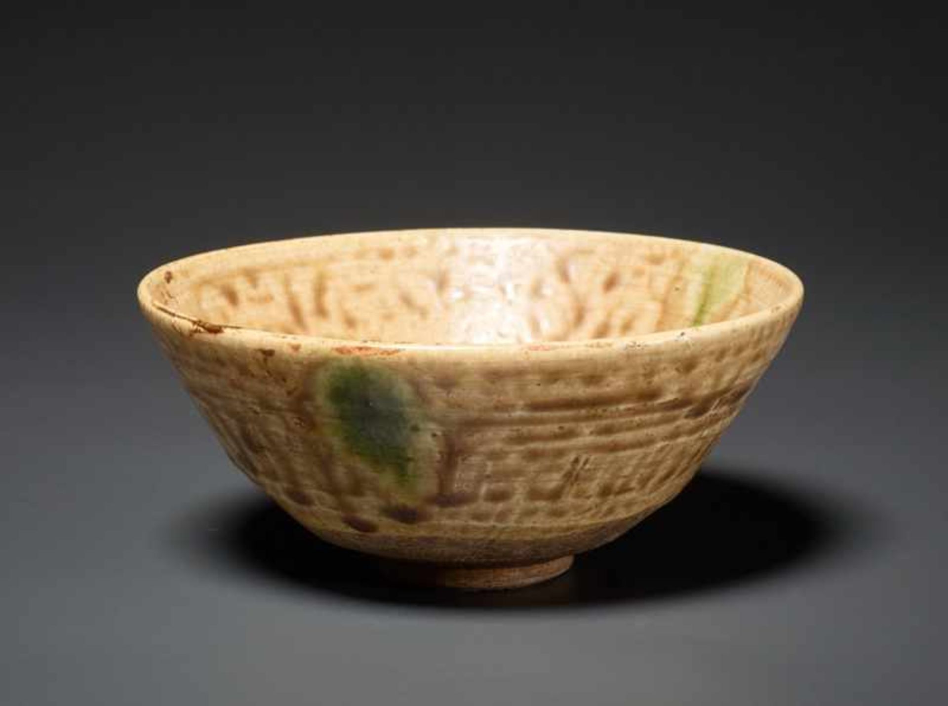 CHAWAN Glazed ceramic. Japan, Funnel-shaped bowl on small foot, the lively glaze featuring a light