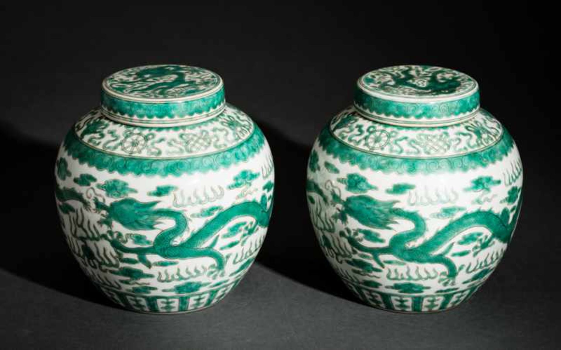 PAIR OF VASES WITH LIDS FEATURING DRAGONS AND GOOD-LUCK SYMBOLS Porcelain with enamel paint.