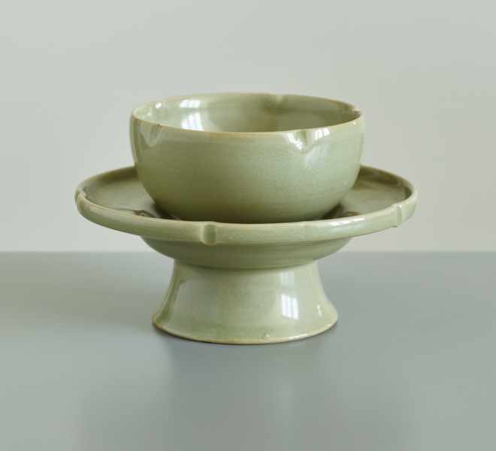 CUP WITH SAUCER Porcelain. China, The saucer has a high, dynamically flared foot and plate-formed