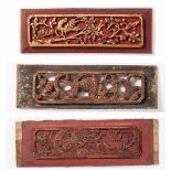 THREE CARVED WOODEN PANELS IN RED AND GOLD Wood and gold. China, 19th cent.Nicely crafted wood