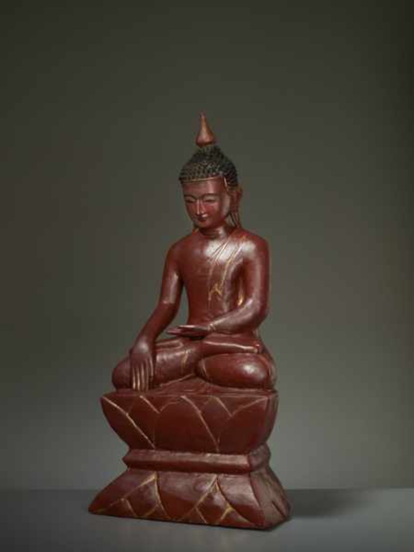 BUDDHA CALLING UPON THE EARTH-GODDESS Wood, lacquer, gilding. Burma, ca. 18th to 19th cent.By