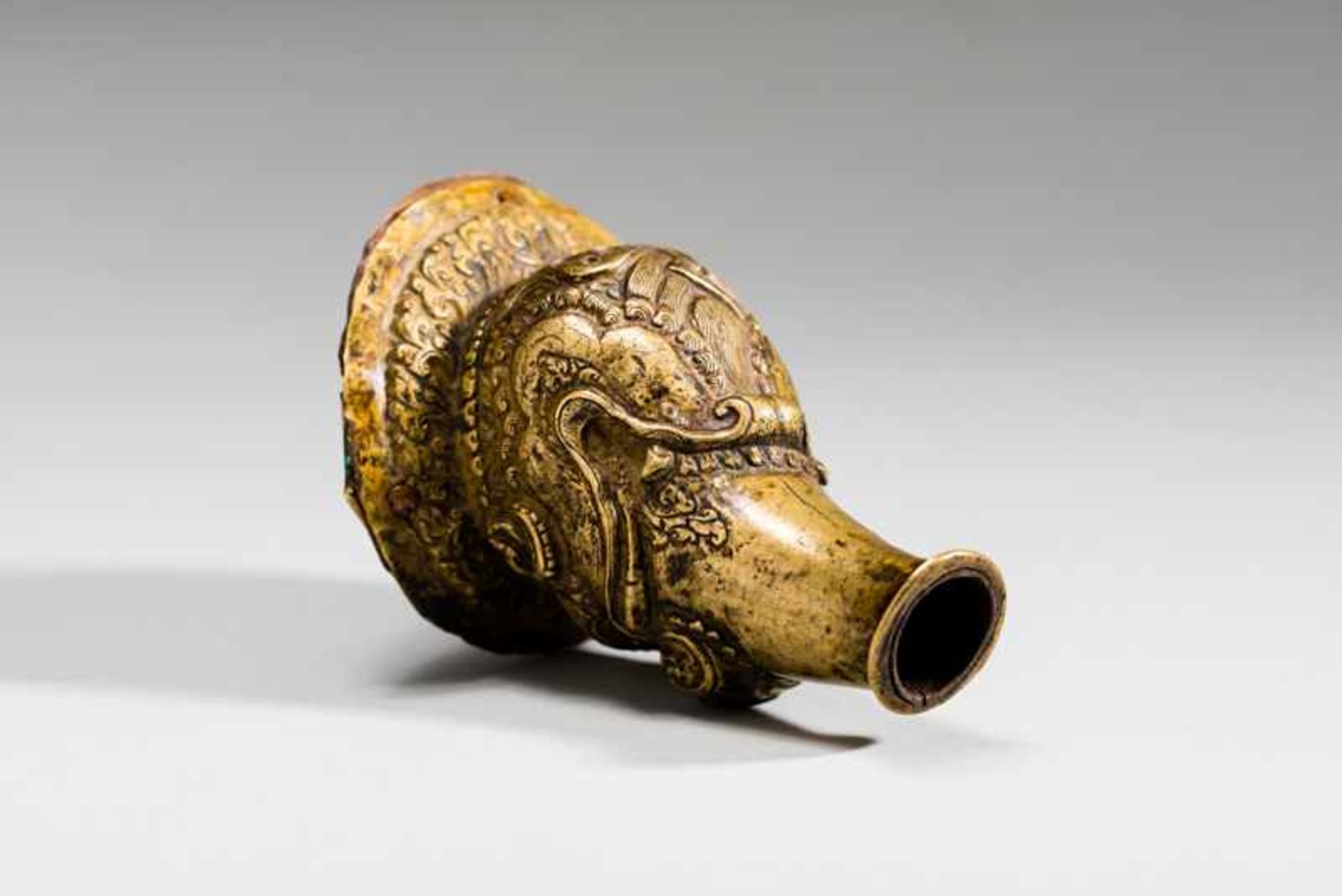 HEAD OF A MYTHICAL CREATURE Yellow bronze. Tibet, ca. 18th to 19th cent.This interesting piece is - Image 4 of 7