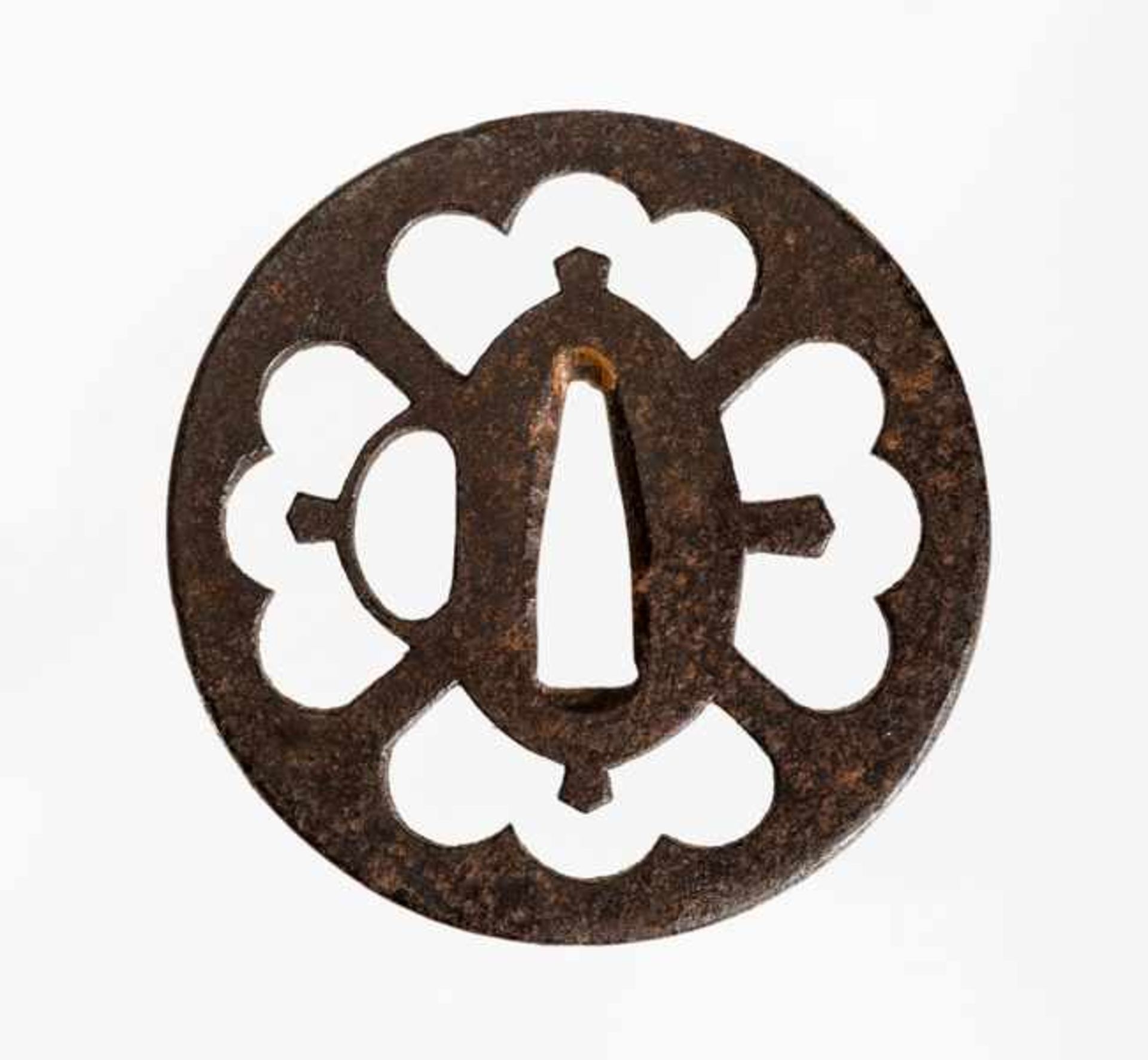 SUKASHI-TSUBA Iron. Japan, 18th to 19th cent.Round, old-style tsuba; both sides flat with multiple