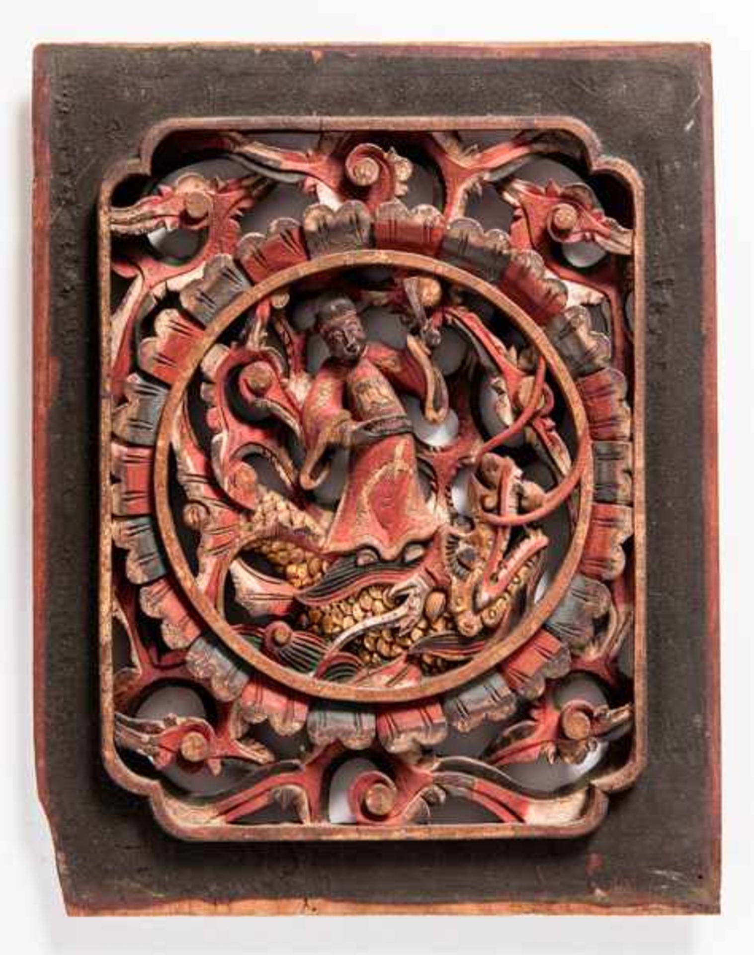 A VERY NICE WOODEN PANEL WITH A DEITY ON A DRAGON Wood with old painting. China, 19th cent.A carving