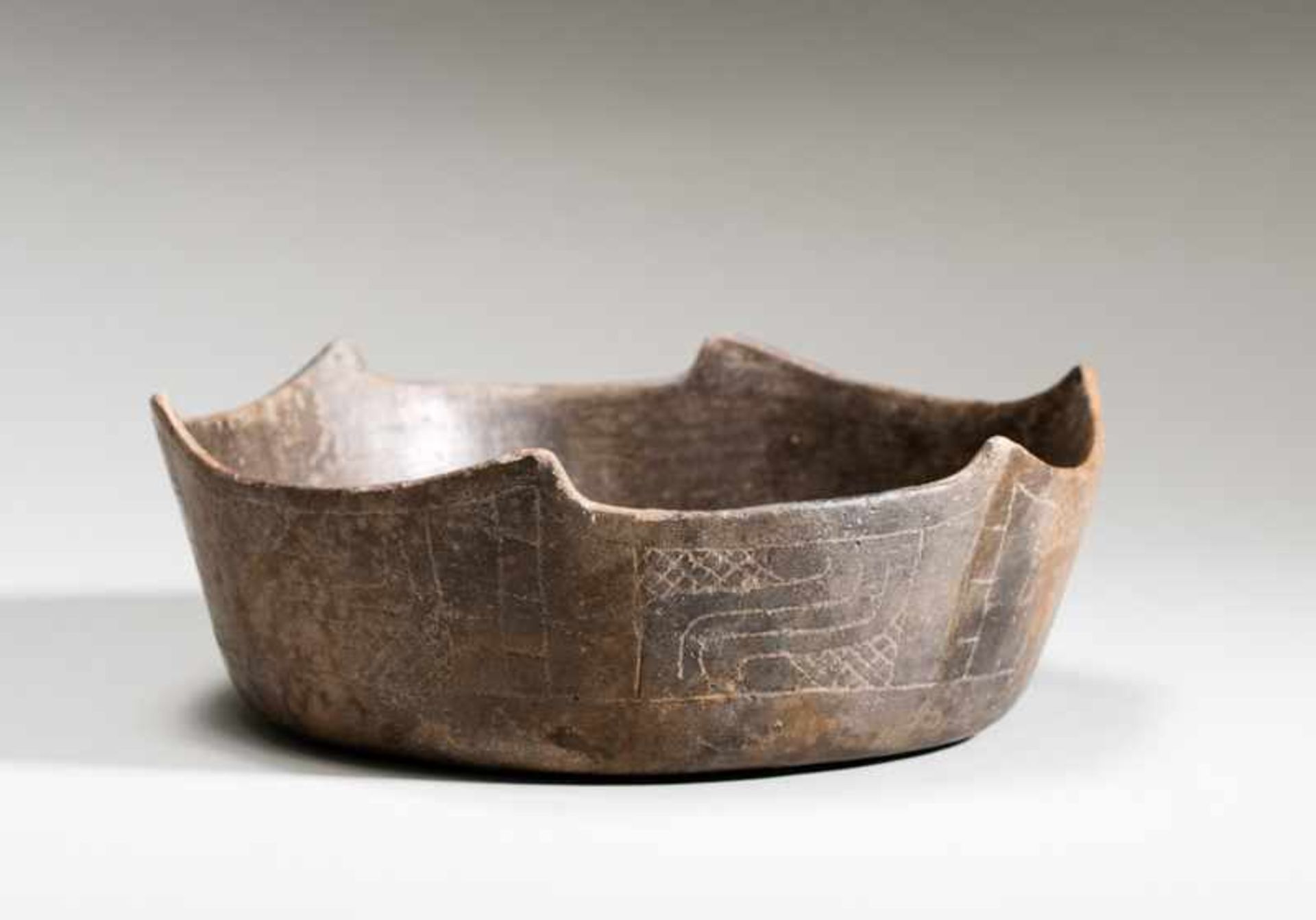 BOWL WITH ANGULAR LIP Terracotta. Chavin, Peru, ca. 500 anteThe lip of this rare, gray-black bowl