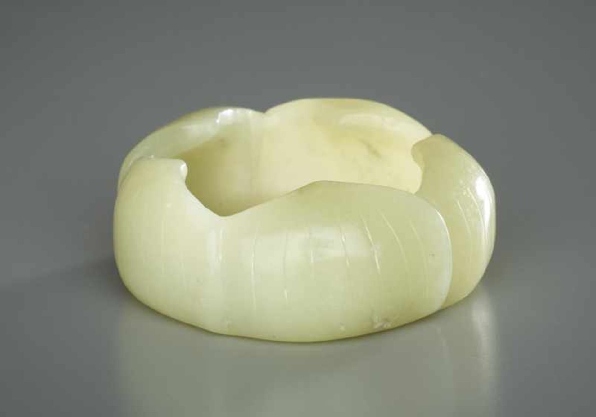 SMALL WATER VESSEL IN LOTUS FORM Jade. China, Qing (1644-1911) to RepublicCircular form of a lotus