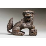 SMOKING VESSEL IN THE SHAPE OF A LION-DOG WITH BALL Bronze. China, Qing dynasty, ca. 18th to 19th