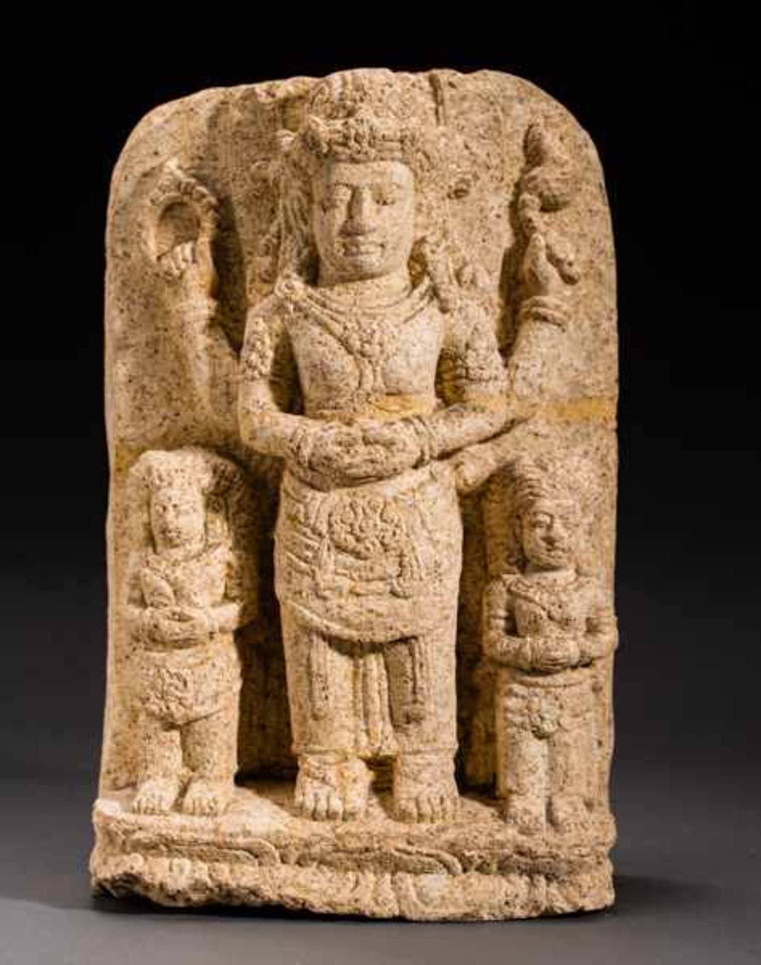 HIGH GOD VISHNU WITH WIVES Tuff. Majapahit, 14th to 15th cent.Very rare stele featuring the high,