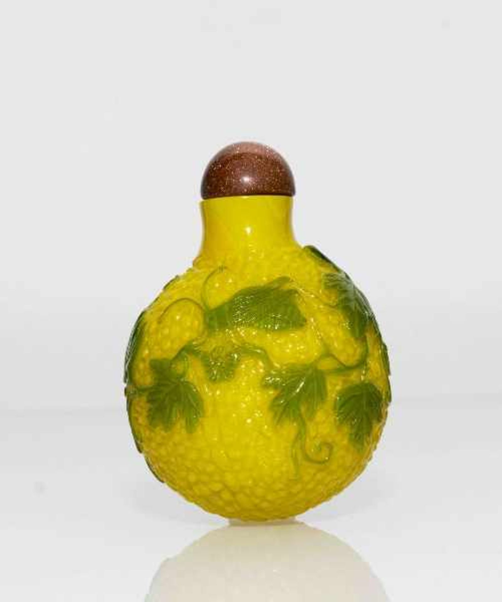 LOCUSTS AND WINE LEAVES Imperial yellow glass with green overlay. China, Spherical form, no base,