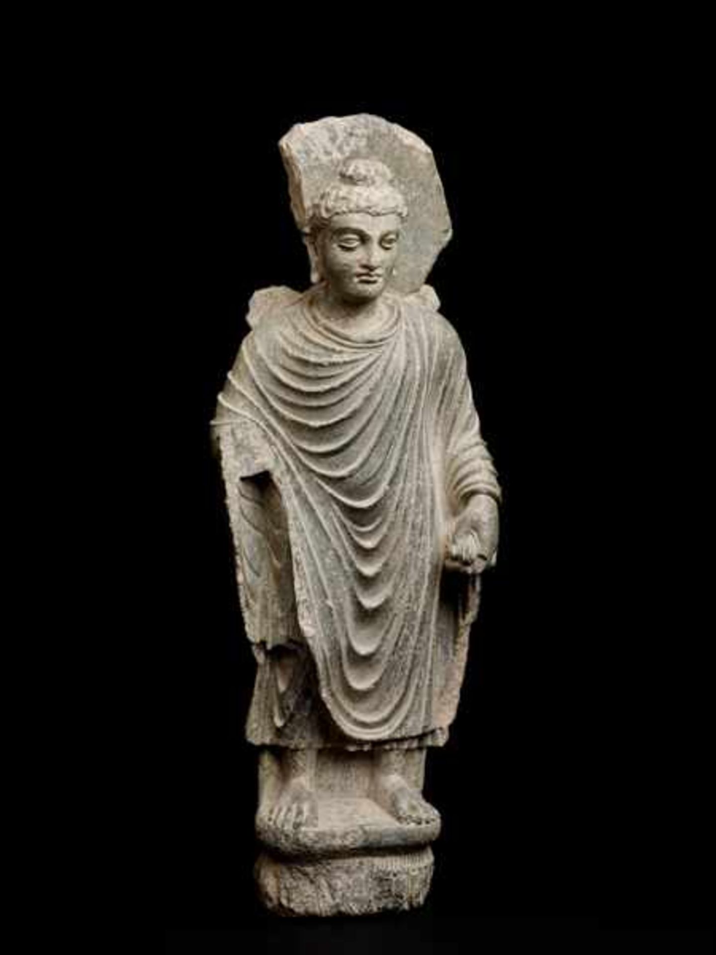 STANDING BUDDHA SHAKYAMUNI Green grey slate. Gandhara, former West-India, 2nd to 3rd cent.A very