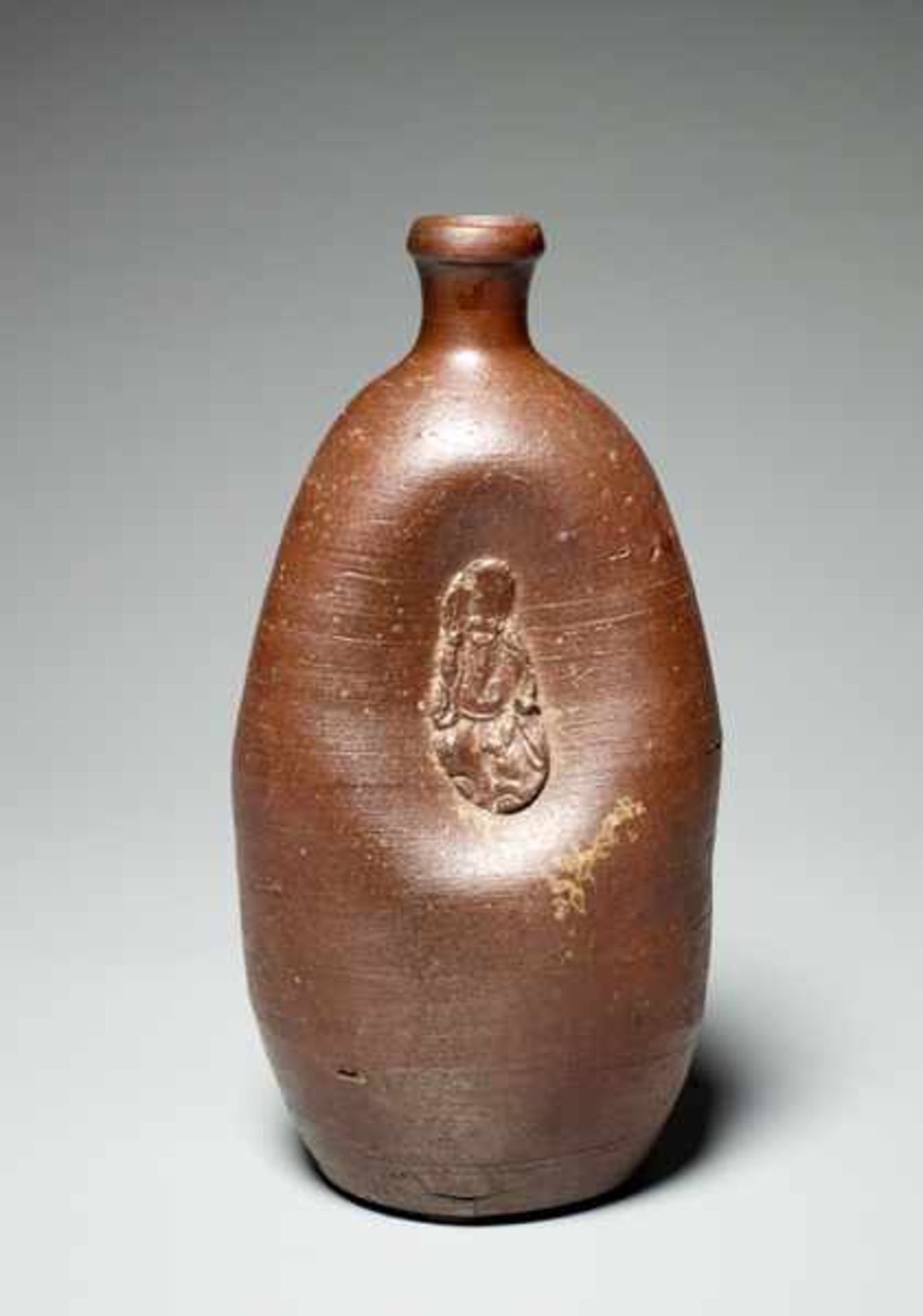 SAKE BOTTLE WITH GOD OF LONG LIFE Glazed ceramic. Japan, ca. 19th cent. to Meiji and laterA