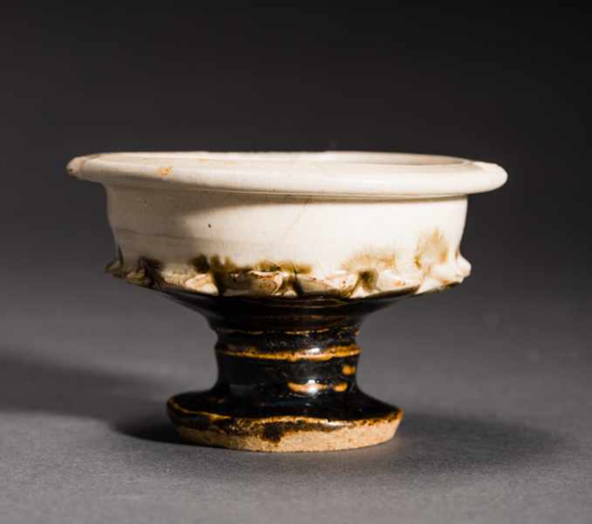 SMALL STEMWARE BOWL Glazed ceramic. China, possibly Ming (1368 -1644)Formally interesting piece.