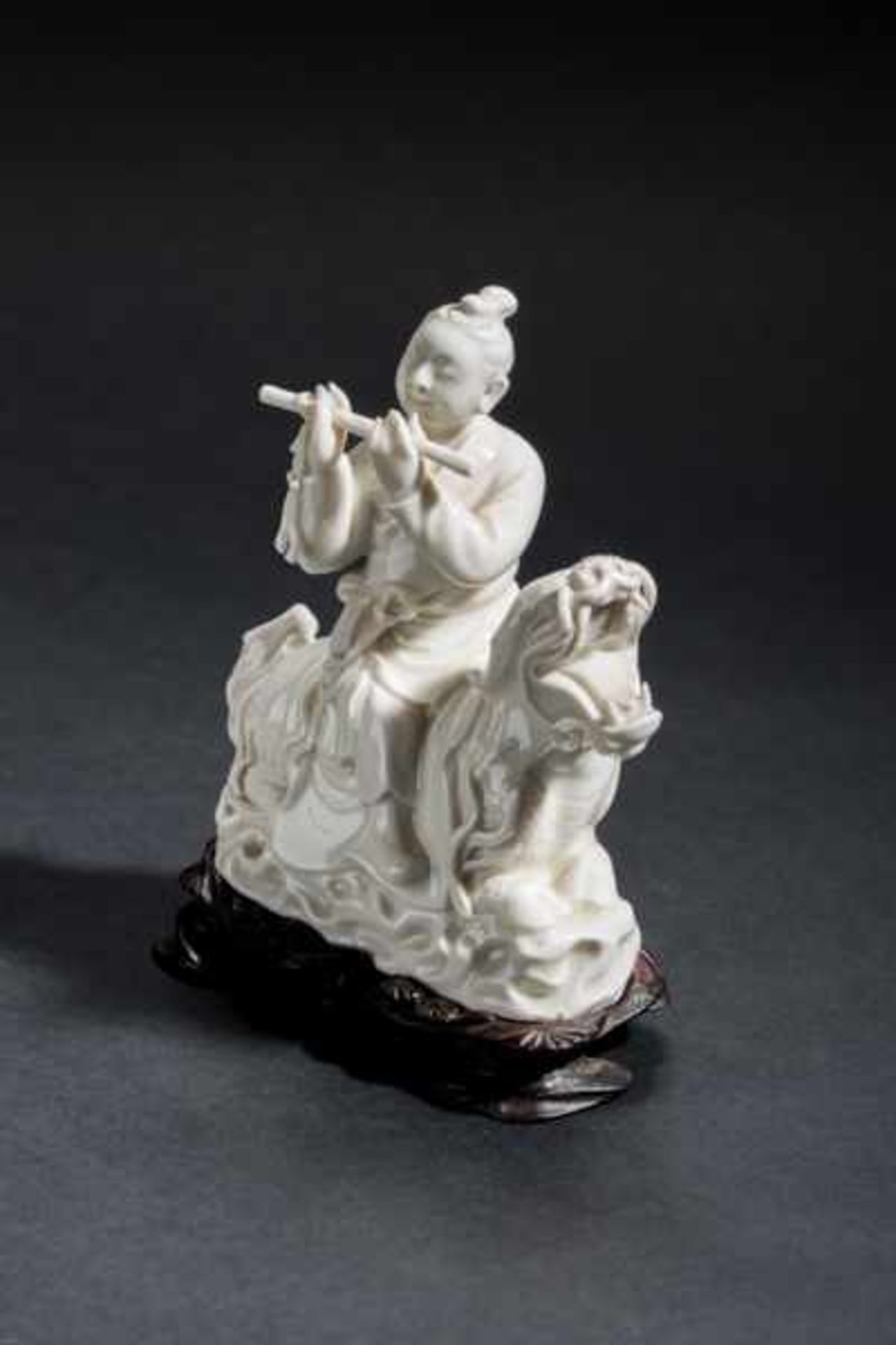 IMMORTAL PLAYING FLUTE Blanc de Chine porcelain. China, Dehua, RepublicHan Xiangzi sitting on a - Image 3 of 6