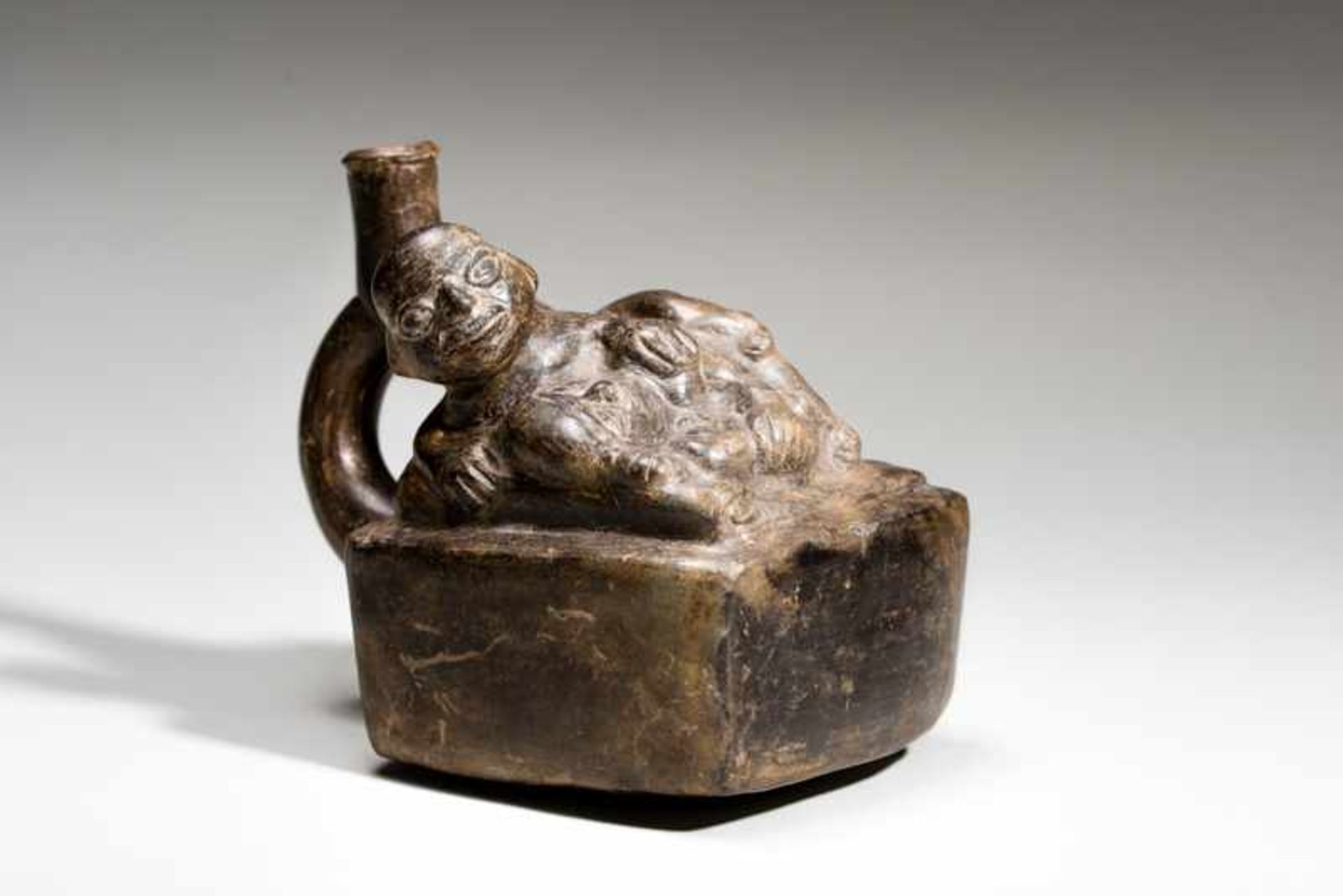 VESSEL WITH TWO LOVERS AND CHILD Terracotta. Moche, ca. 4th cent. (TL-tested)This unusual piece