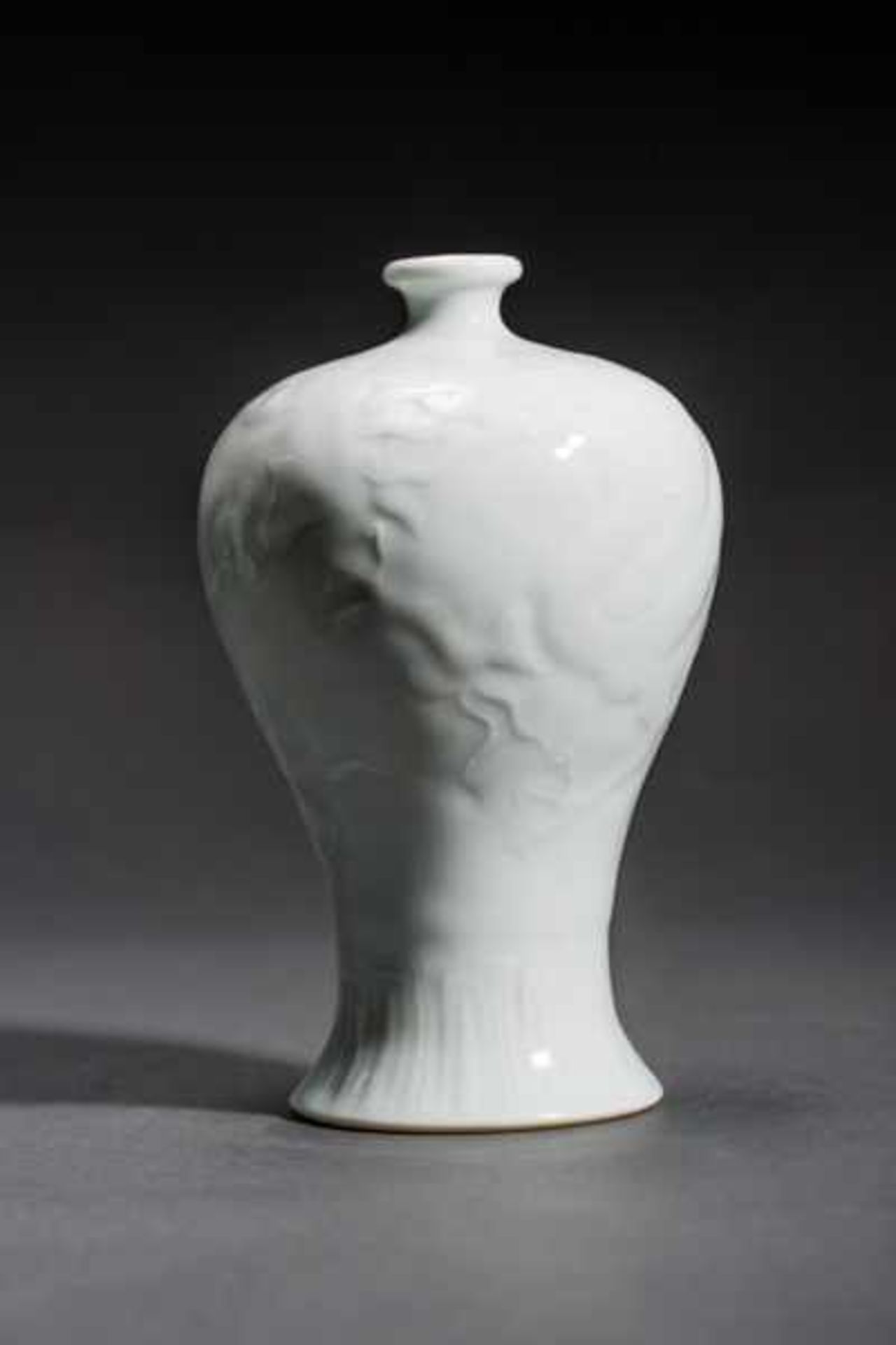 SMALL MEIPING VASE WITH DRAGON Porcelain. China, This small meiping vase is completely white and