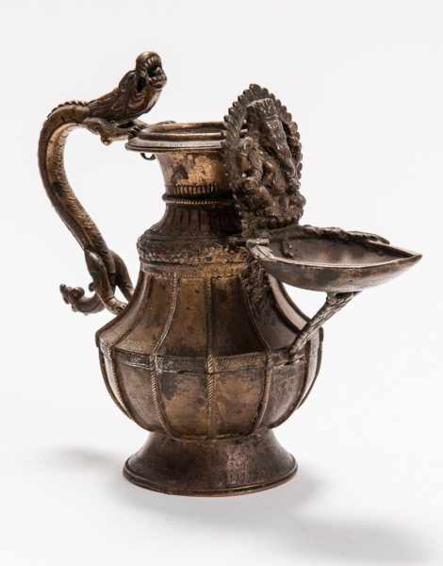 LIBRATION VESSEL WITH DRAGON AND GANESHA Gilding bronze. Nepal/Tibet,, 19th cent.An elaborately