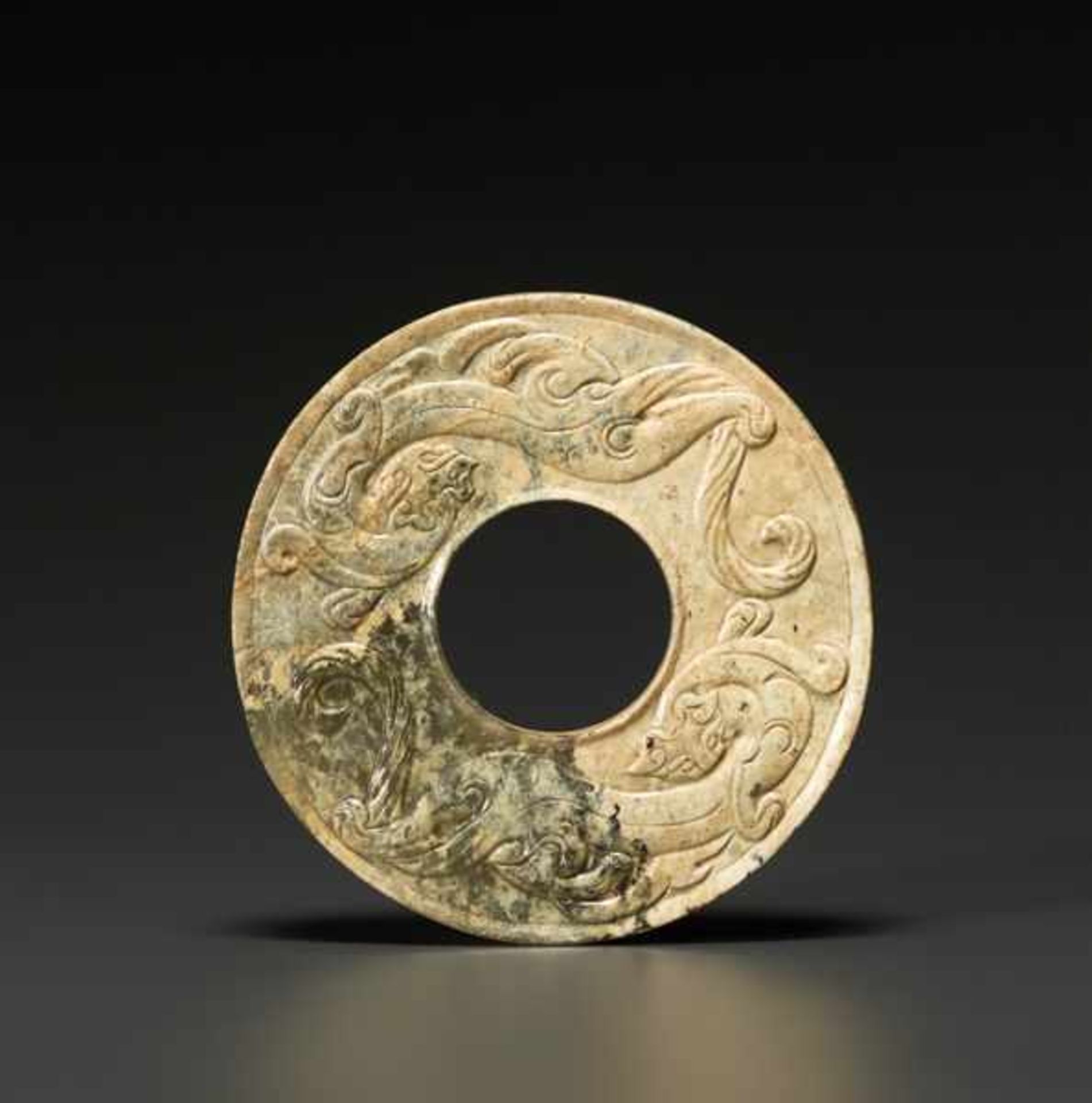 SMALL BI FEATURING DRAGONS Jade. China, Han dynasty, 206 BC - 220 CEA small decorative piece in