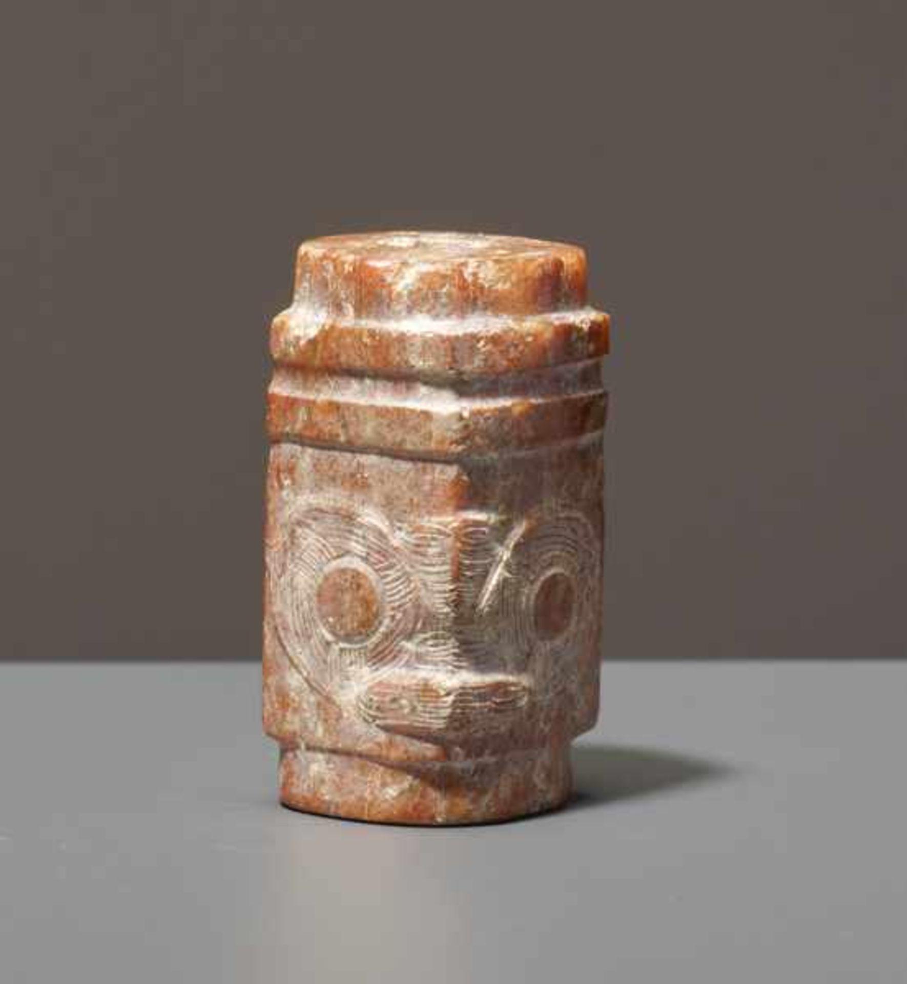 BEAD IN THE SHAPE OF A CONG Jade. China, neolithic Liangzhu culture, ca. 3300 - 2200 BCFormally