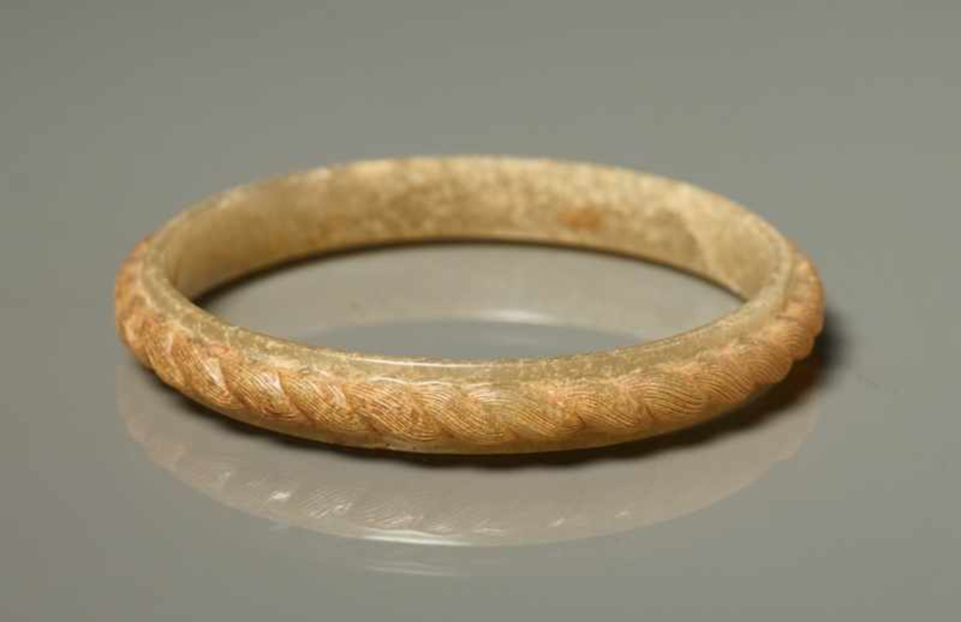 BRACELET Jade. China, Zhanguo ca. 4th - 3rd century BCAn elegant, closed bracelet with a smooth