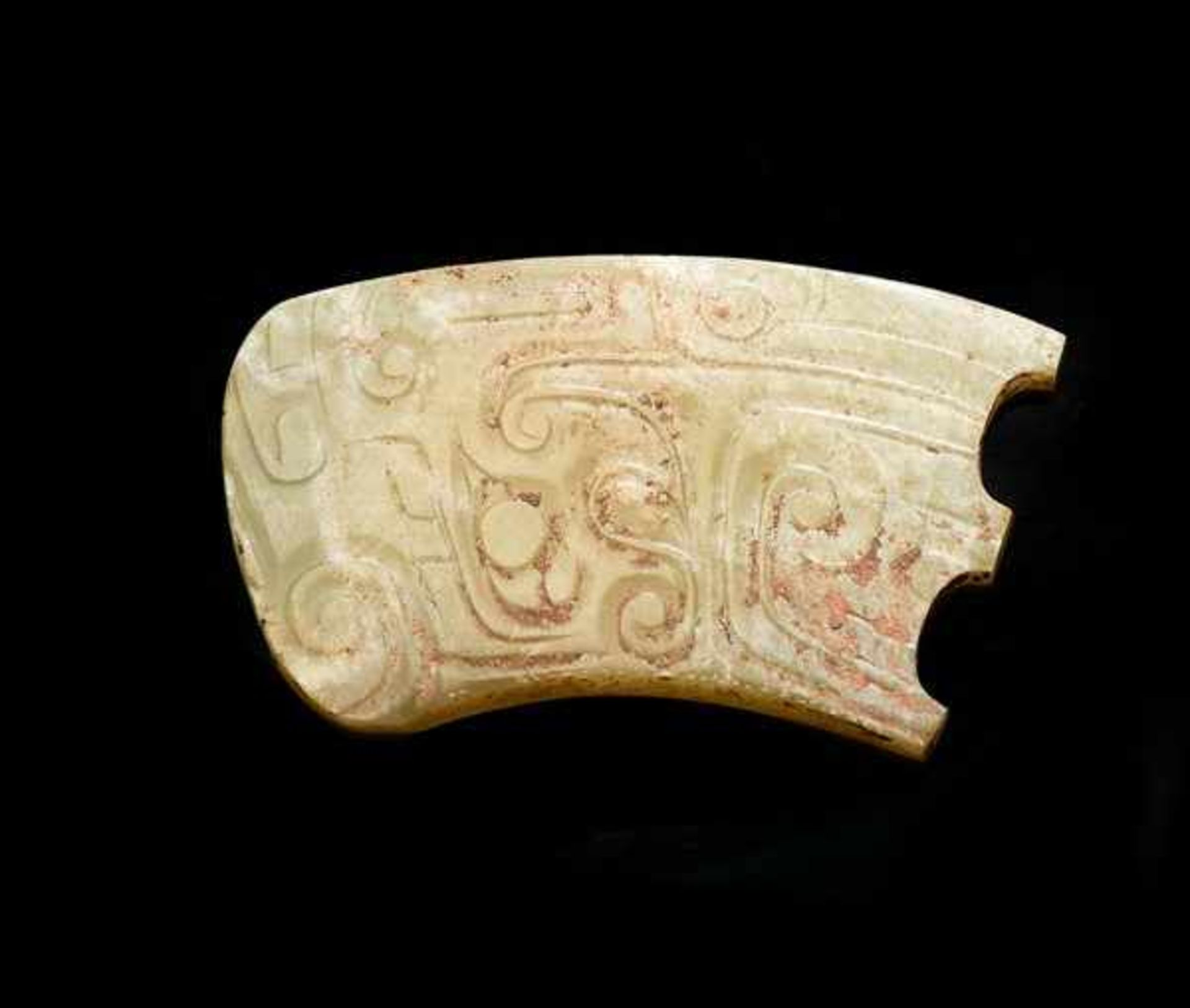 DECORATIVE PIECE WITH DRAGON HEAD Jade. China, Western Zhou, 10th - 9th century BCA small, very