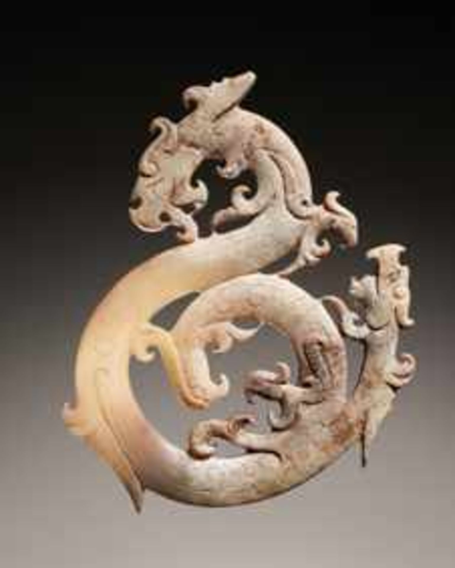 DRAGON AND PHOENIX SHAPED PENDANT Jade. China, Eastern Han dynasty, 25-220 ADA very elegantly