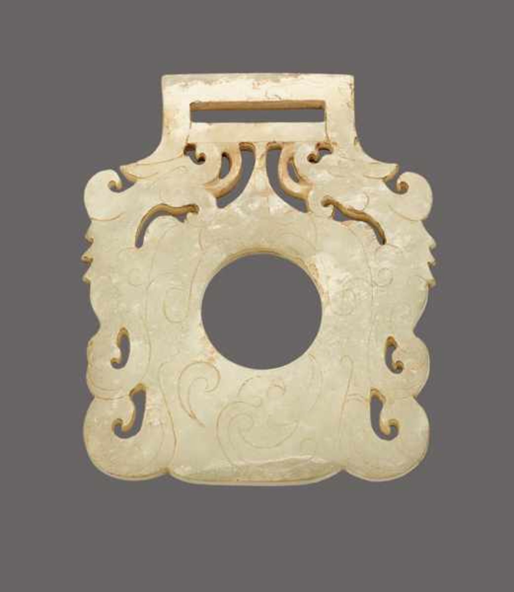 BUCKLE DECORATED WITH DRAGONS AND PHOENIXES Jade. China, Western Jin dynasty, 4th century ADThis