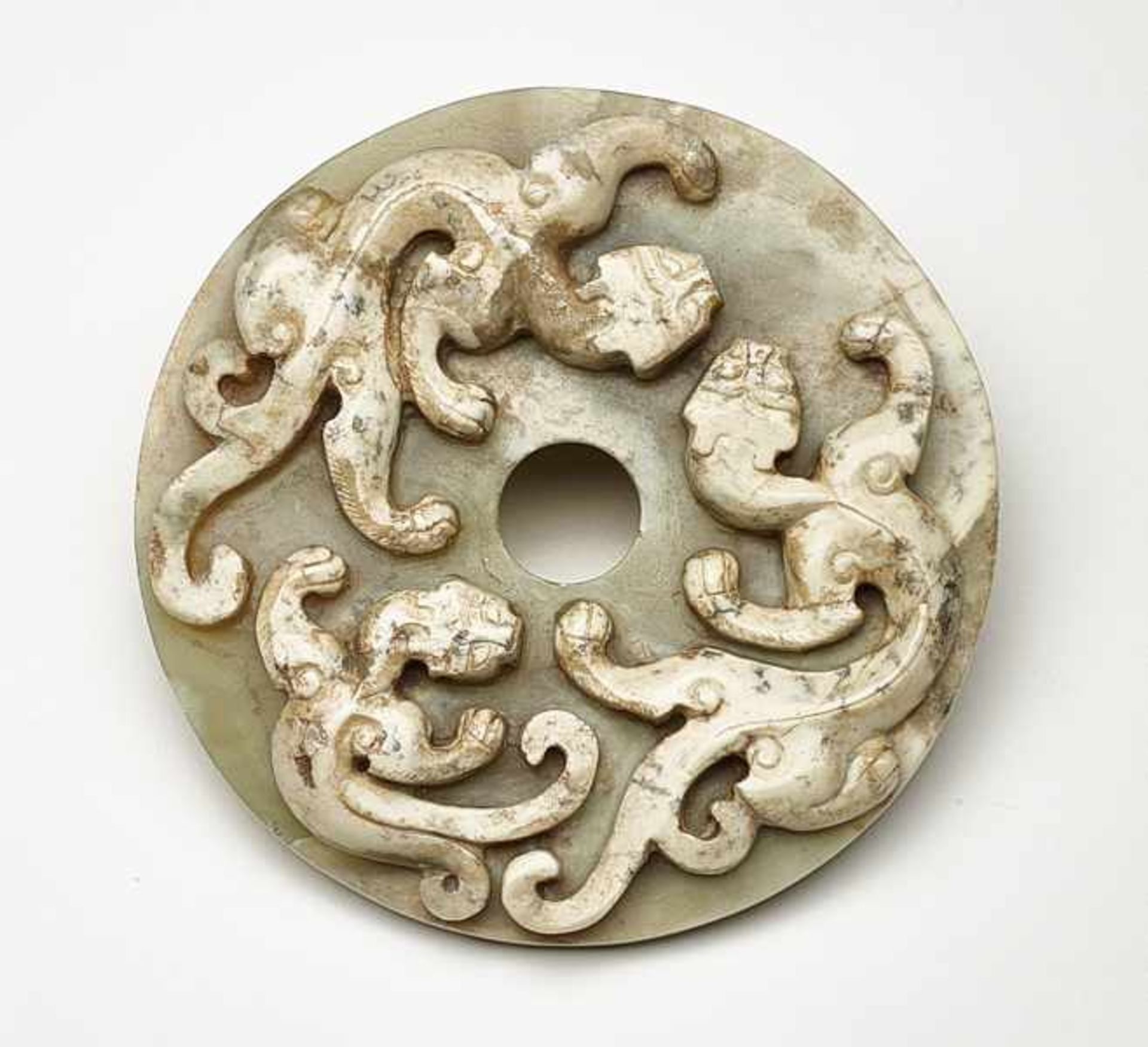 BI-DISC WITH DRAGONS Jade. China, Han dynasty, 2nd - 1st century BCThis rather small bi features