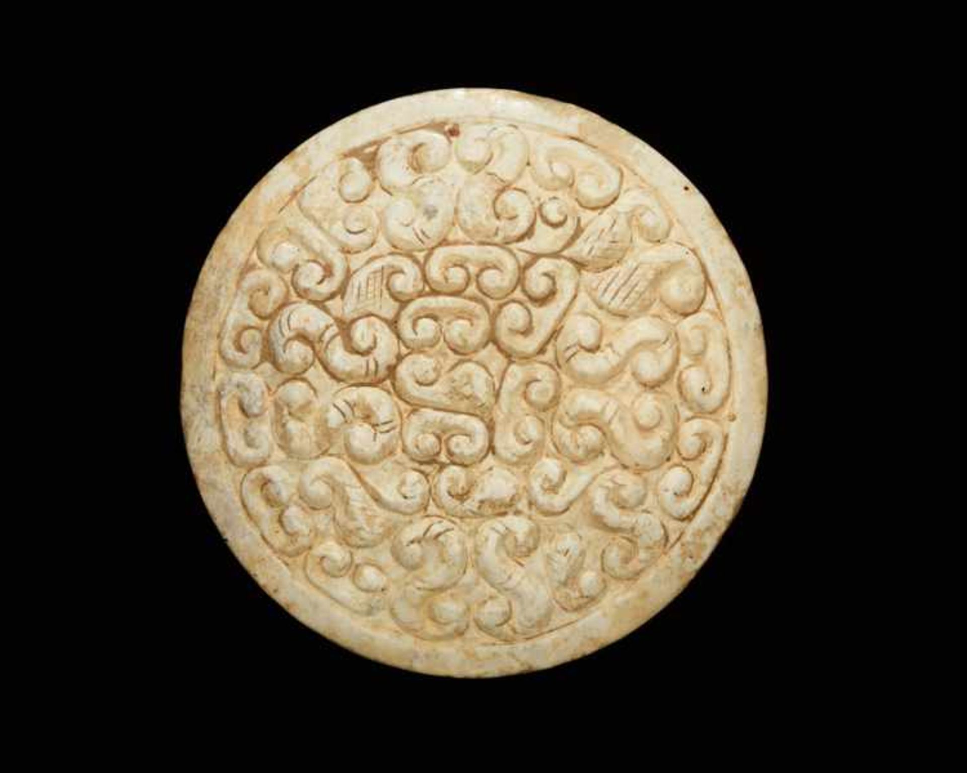 DECORATIVE PENDANT Jade. China, Eastern Zhou, 6th - 5th century BCborder is a very lively