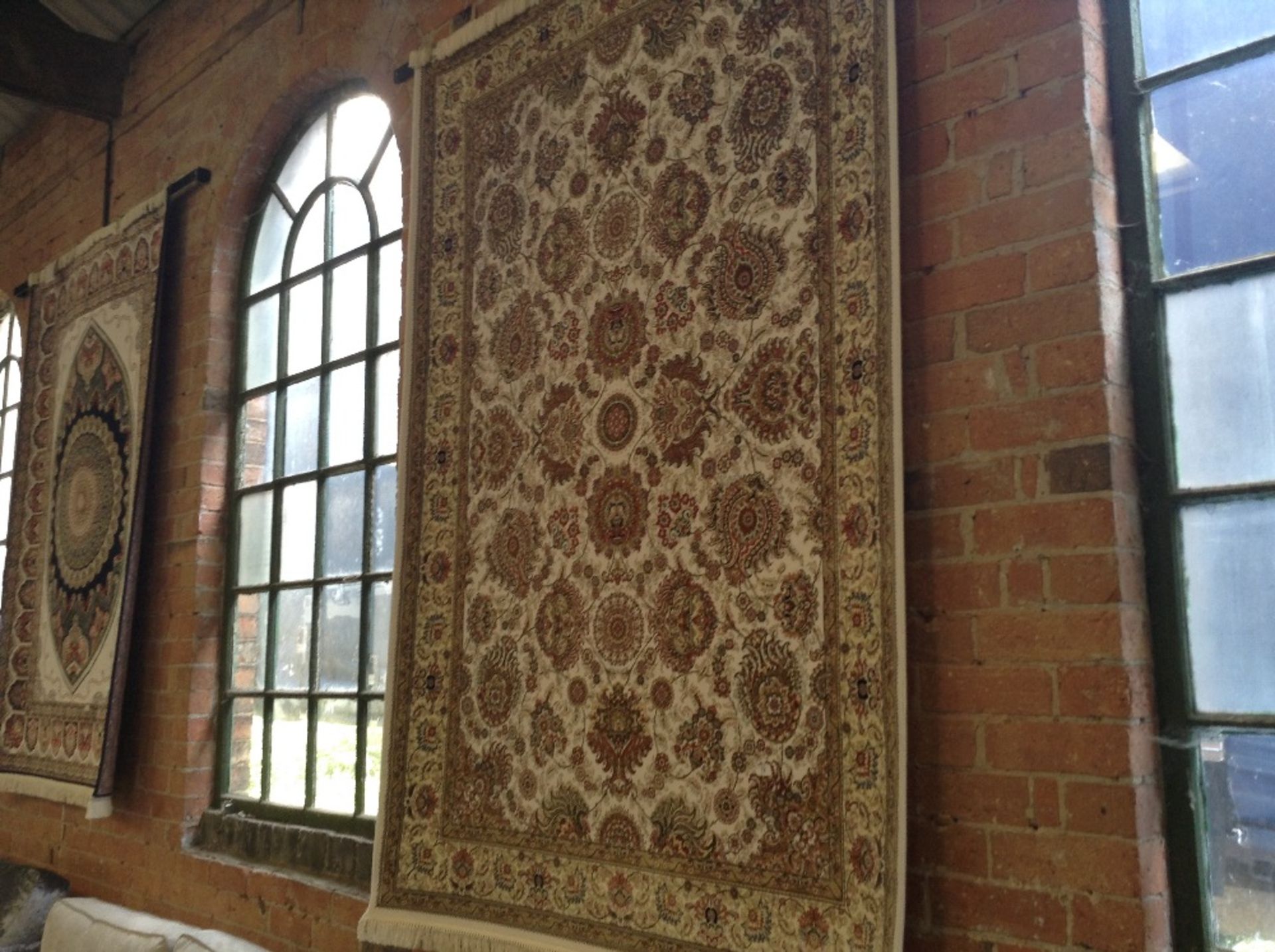 IVORY GROUND WOVEN SILK RUG WITH ALL OVER FLORAL D