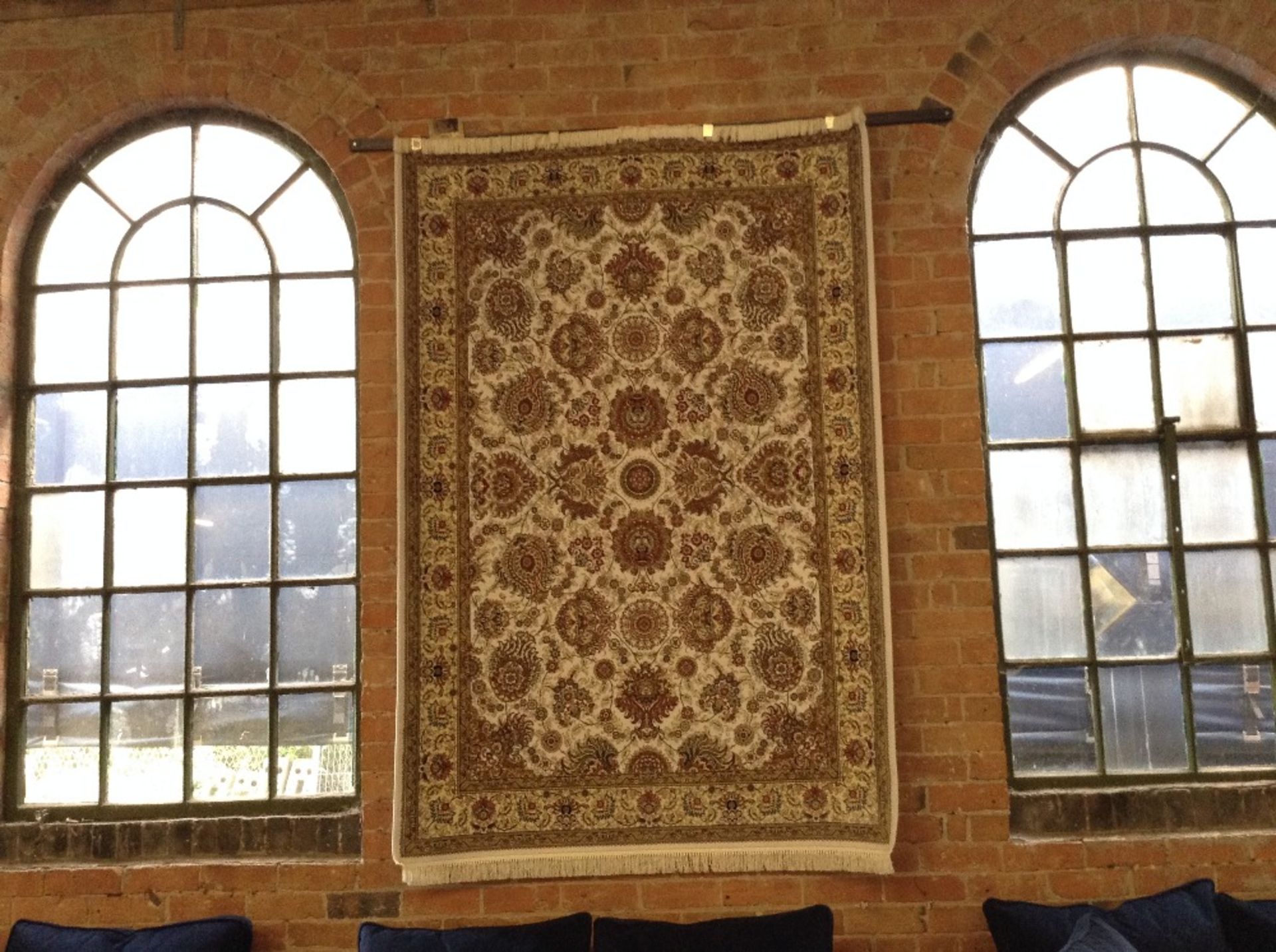 IVORY GROUND WOVEN SILK RUG WITH ALL OVER FLORAL D