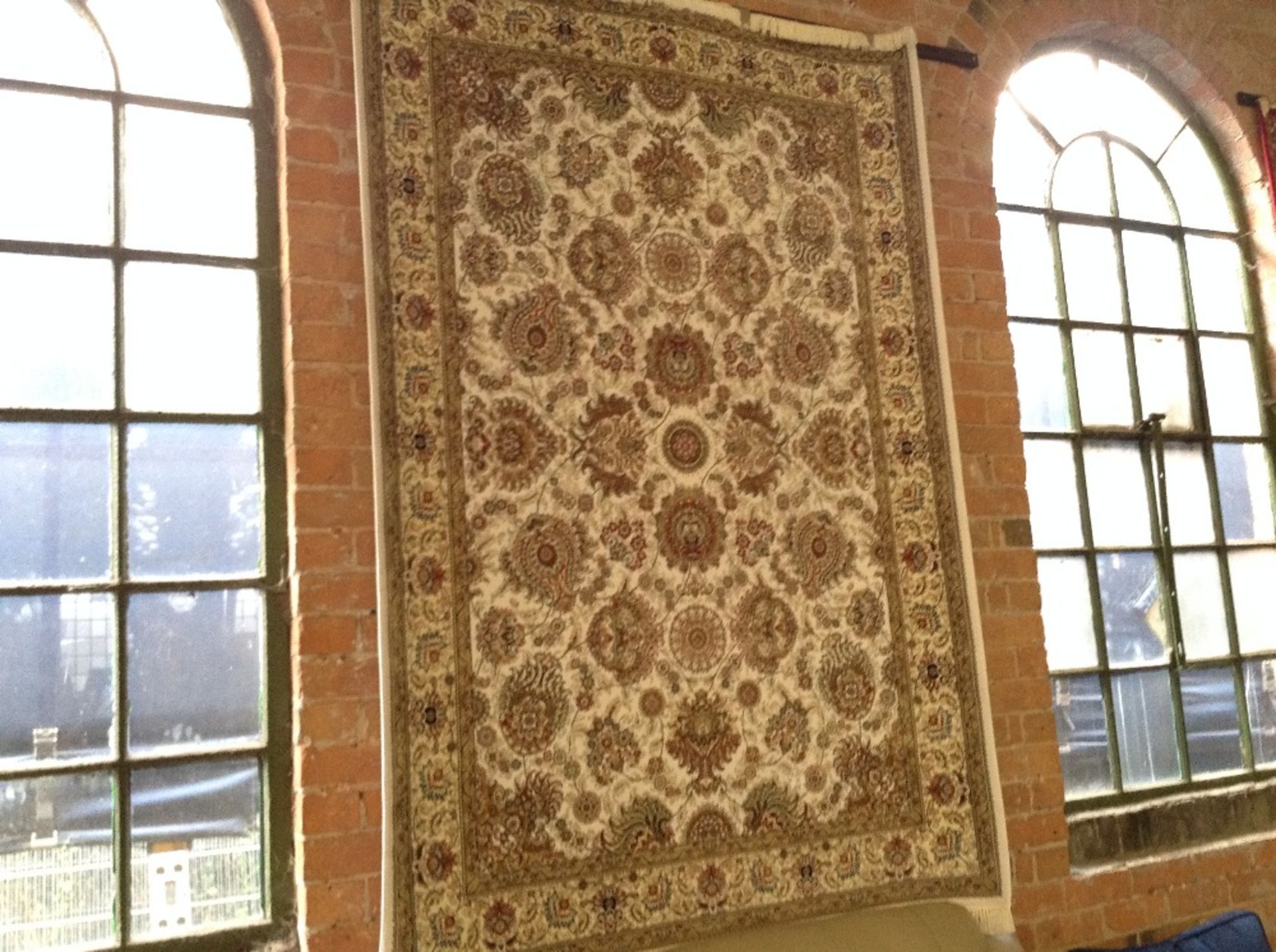 IVORY GROUND WOVEN SILK RUG WITH ALL OVER FLORAL D