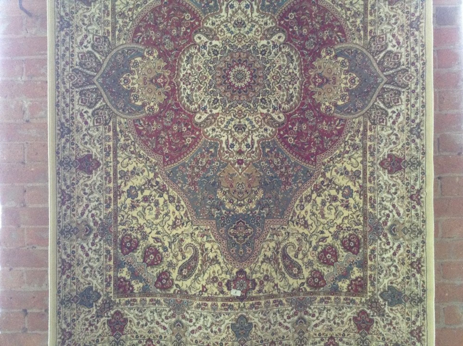 IVORY GROUND WOVEN SILK RUG WITH A UNIQUE MEDALLIO