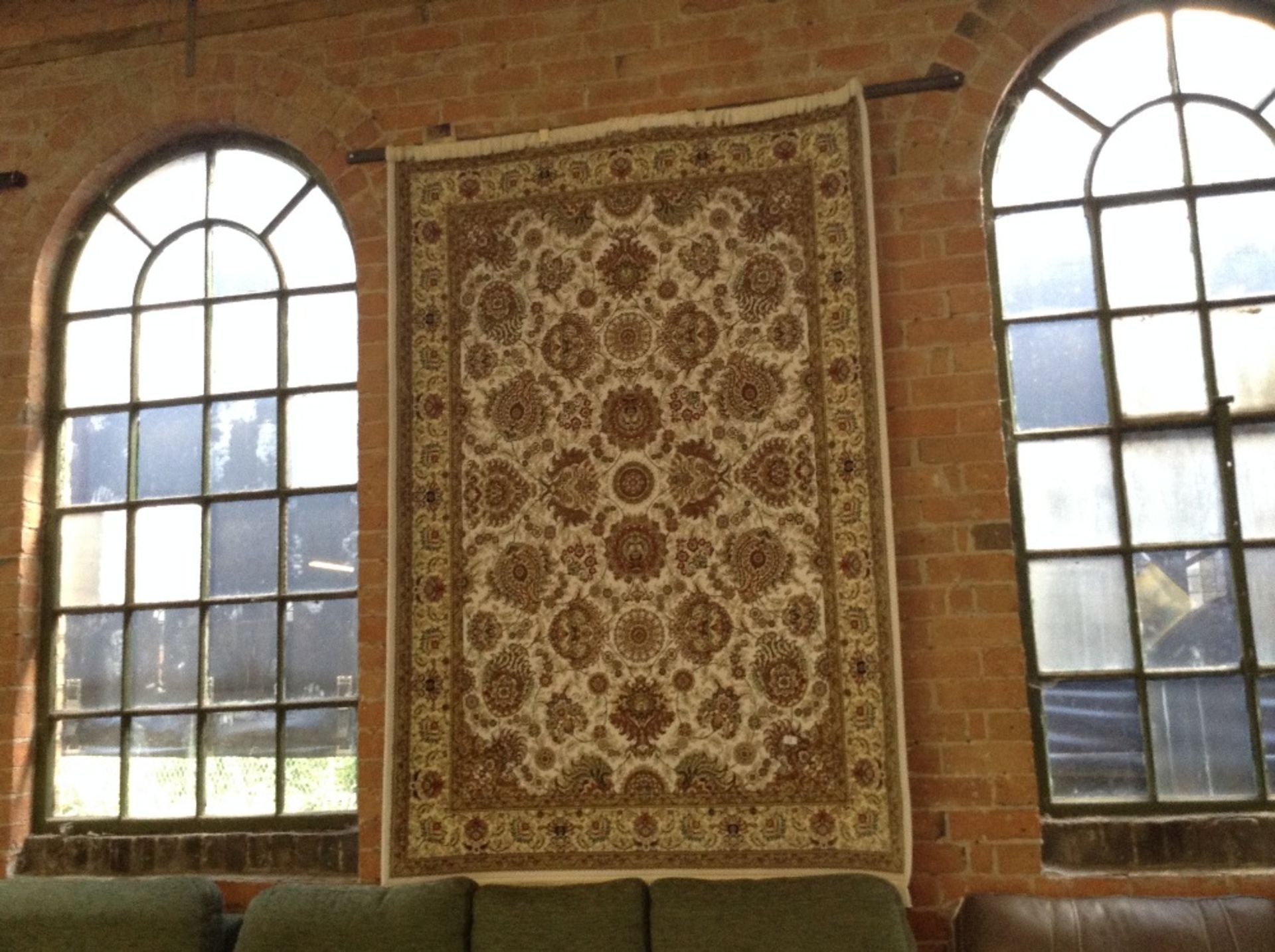 IVORY GROUND WOVEN SILK RUG WITH ALL OVER FLORAL D