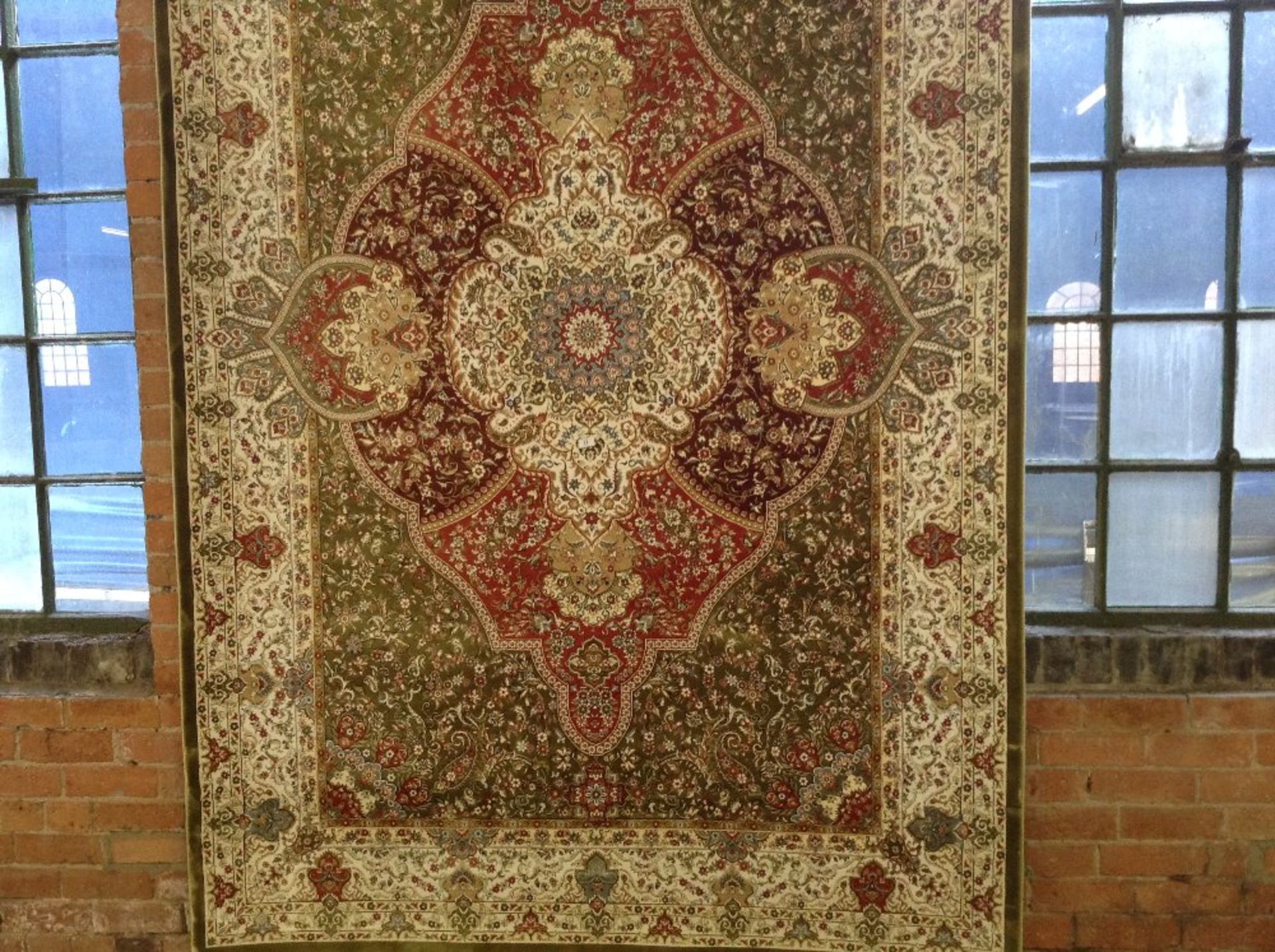 GREEN GROUND WOVEN SILK CARPET WITH TRADITIONAL ME