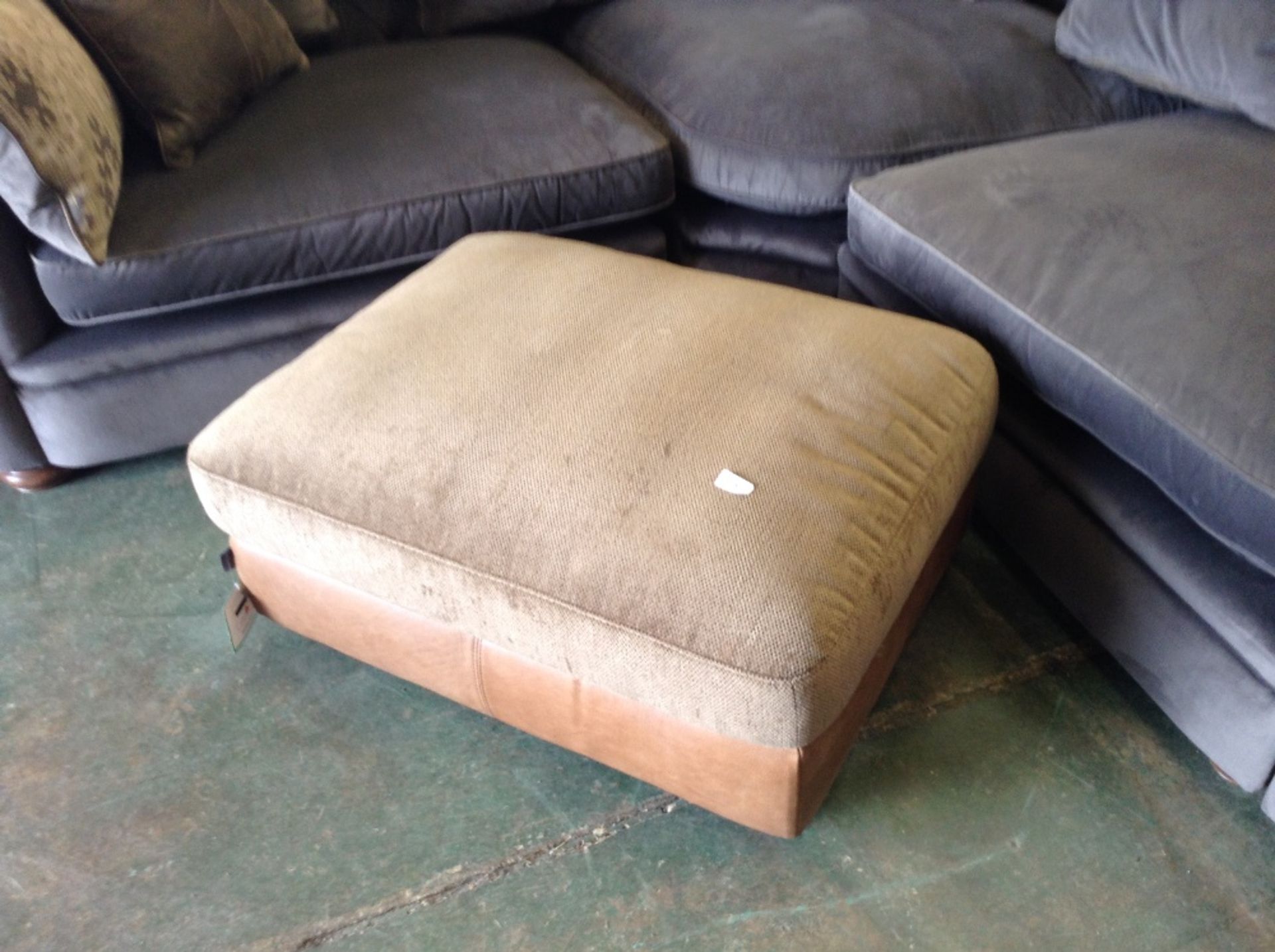 BROWN HALF HIDE FOOTSTOOL (missing correct feet)