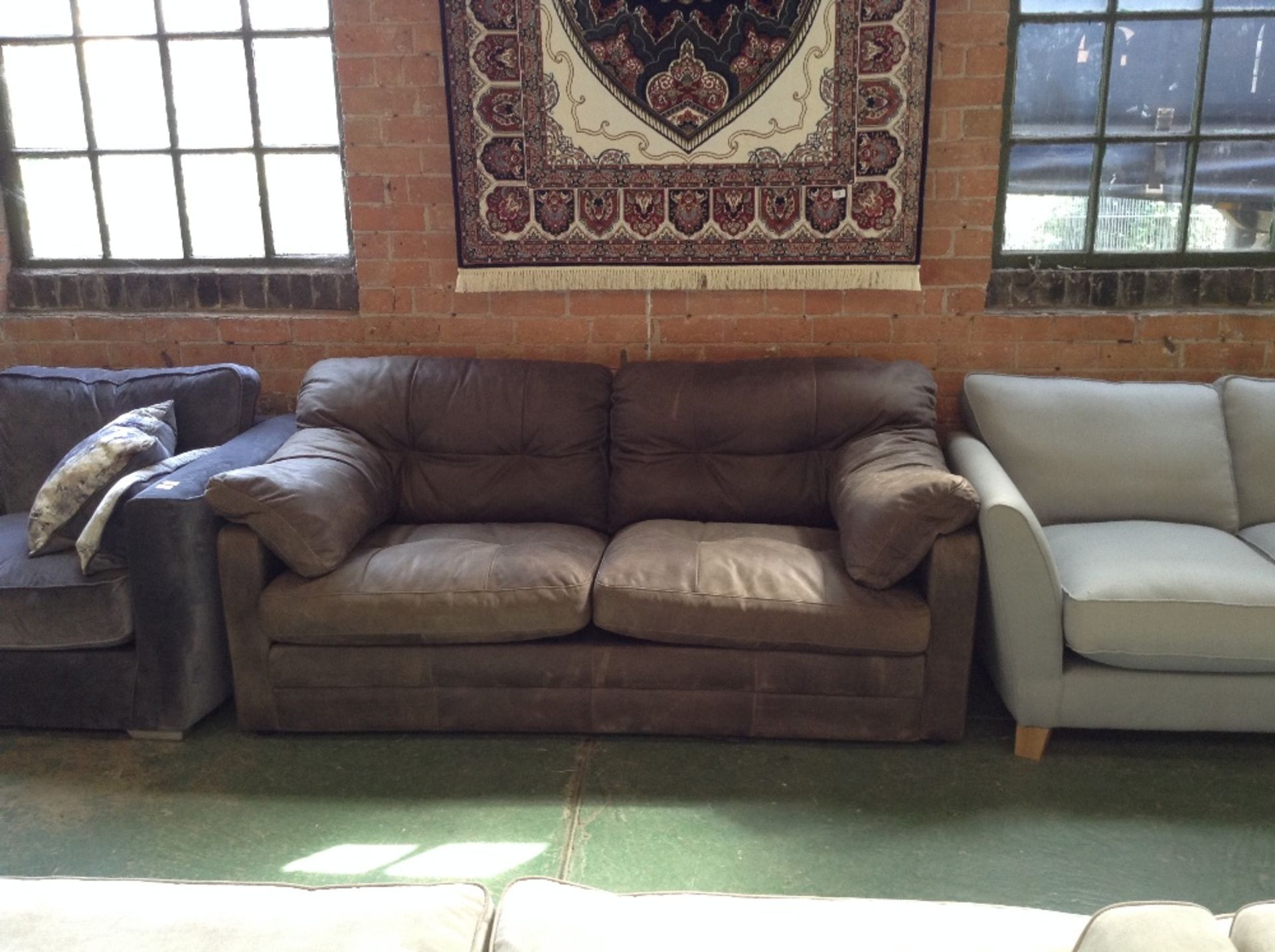 BROWN LEATHER 3 SEATER SOFA (slight rip on the bot