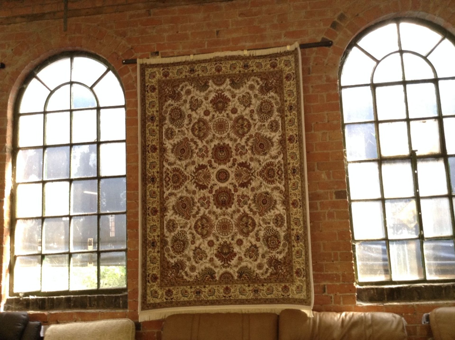 IVORY GROUND WOVEN SILK RUG WITH ALL OVER FLORAL D