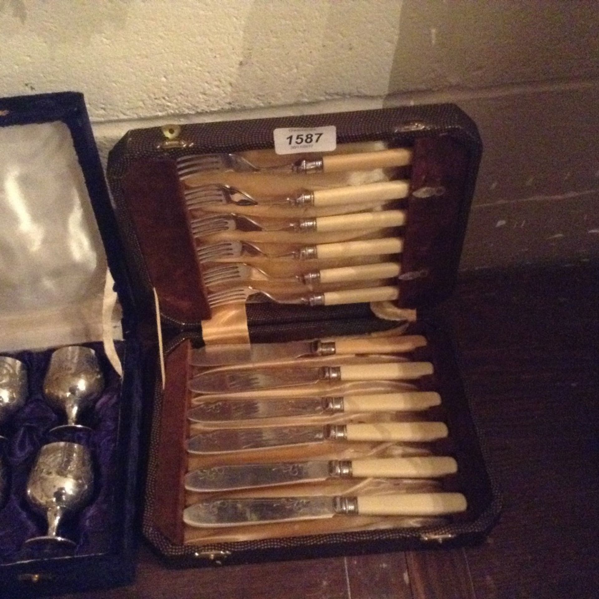 DISPLAY CASE OF KNIVES AND FORKS