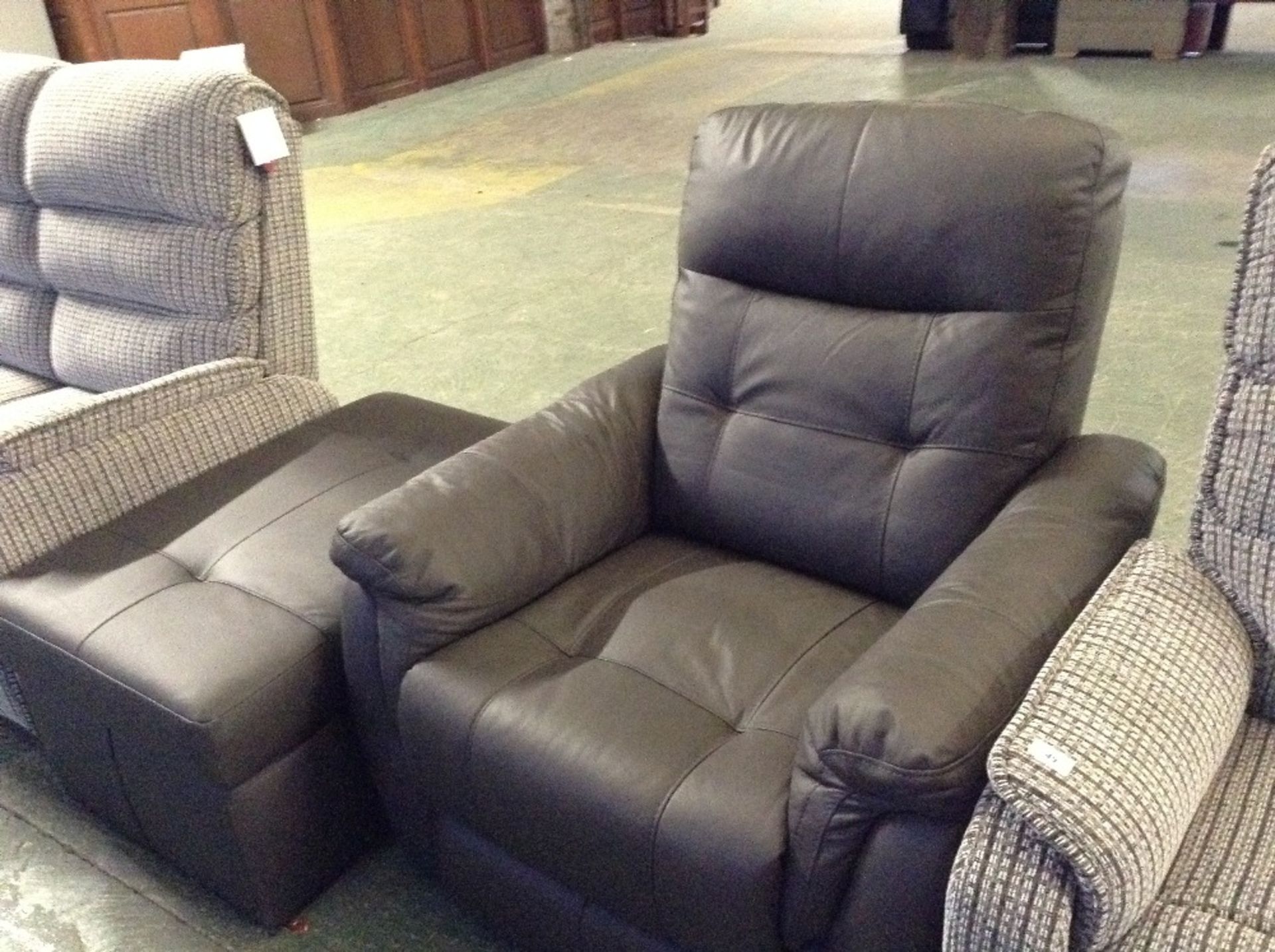 BROWN LEATHER MANUAL RECLINING CHAIR AND LARGE STO