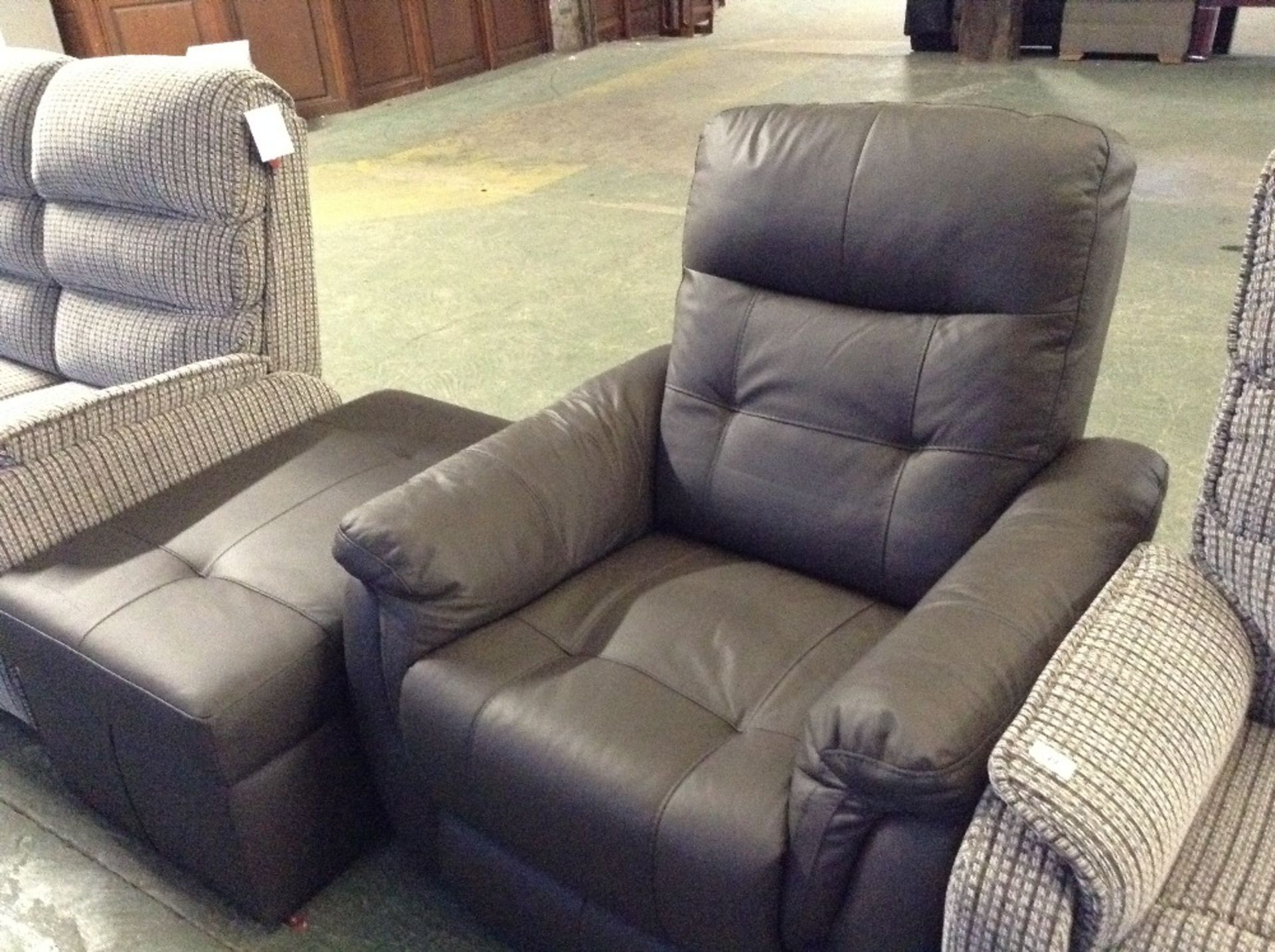 BROWN LEATHER MANUAL RECLINING CHAIR AND LARGE STO