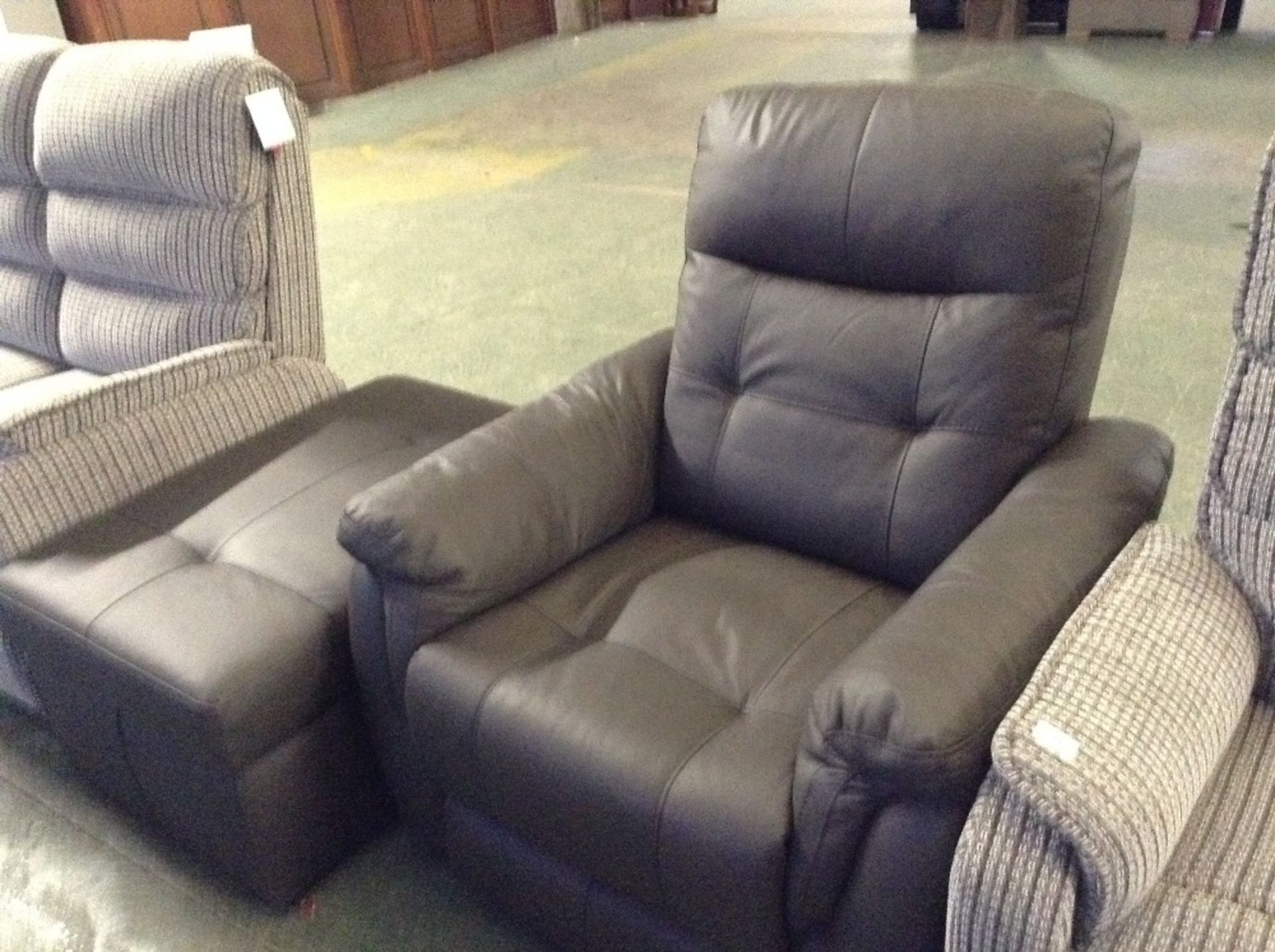 BROWN LEATHER MANUAL RECLINING CHAIR AND LARGE STO