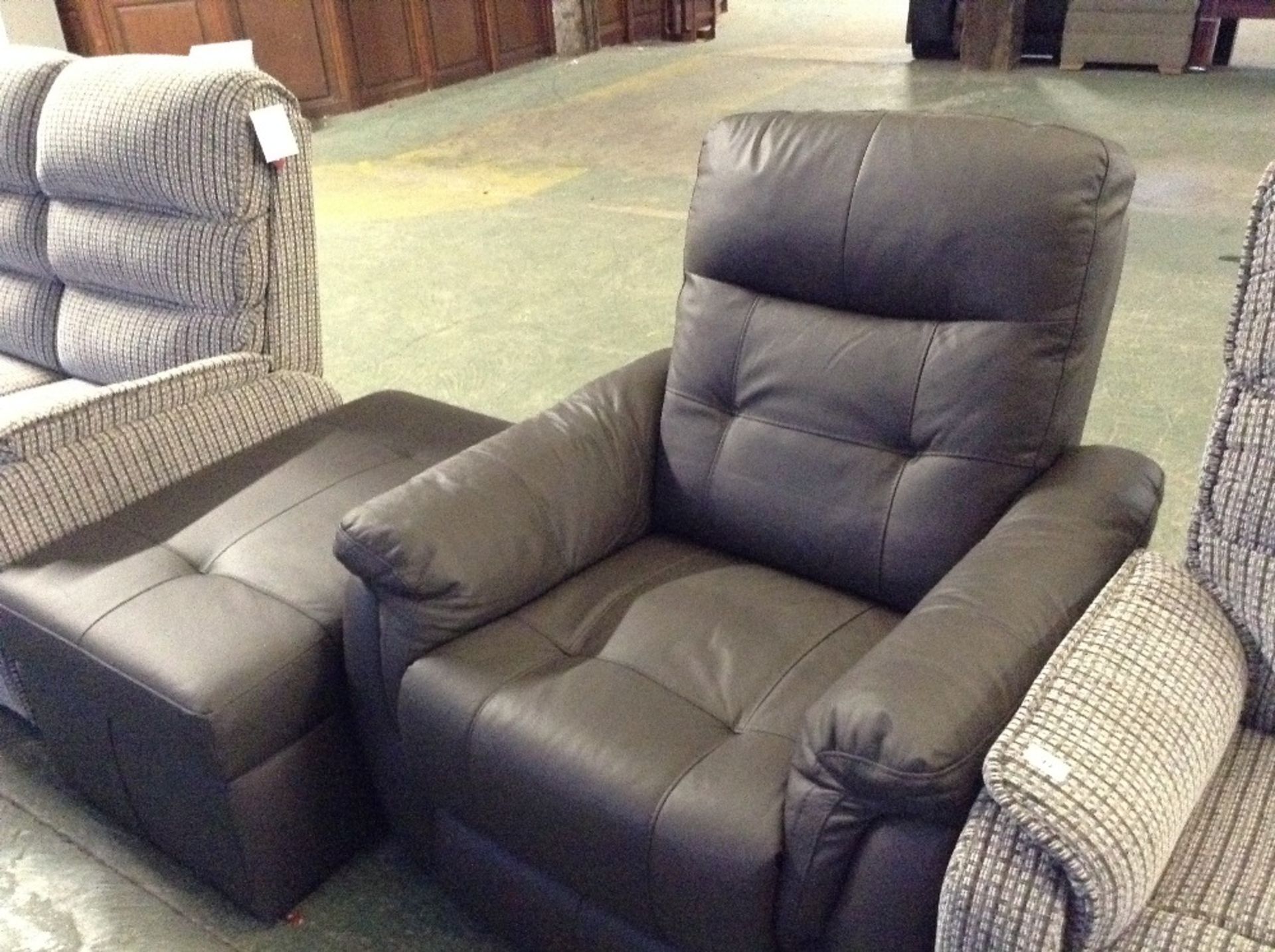 BROWN LEATHER MANUAL RECLINING CHAIR AND LARGE STO