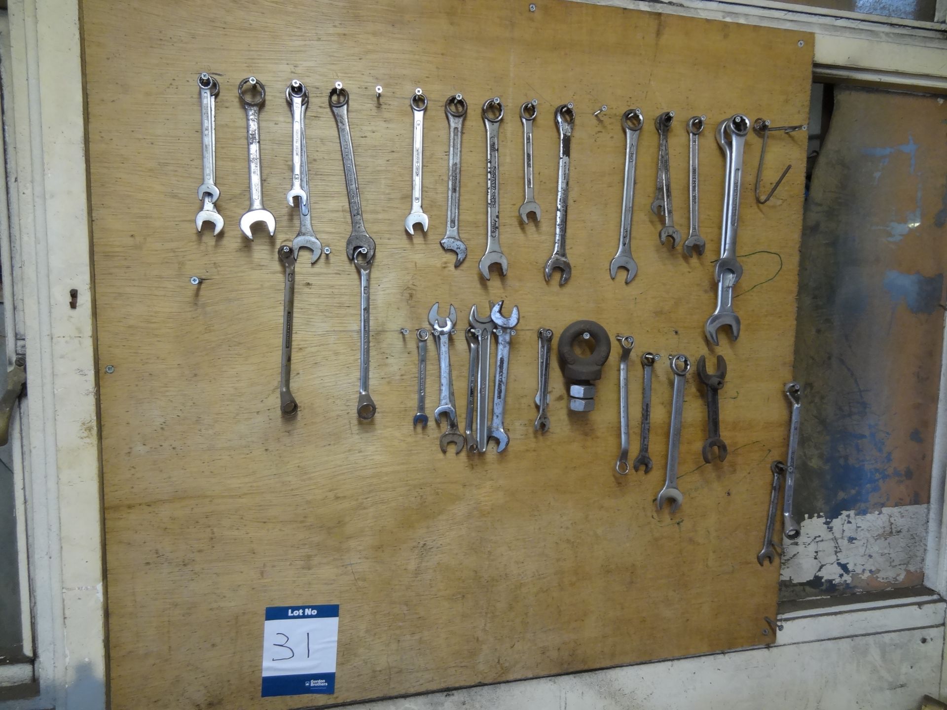 Quantity of metric and imperial spanners on wall board (Lift out charge £5 plus VAT)