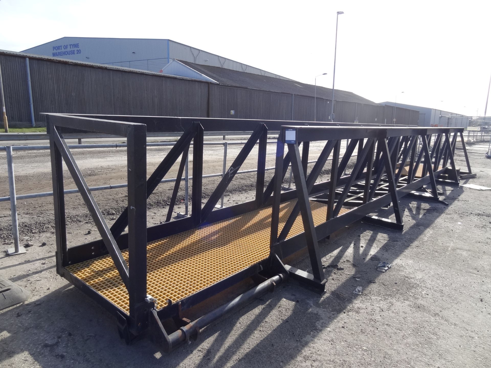 heavy duty fabricated steel walkway, 11000mm x 1300mm x 1300mm, fitted with antislip decking (Lift