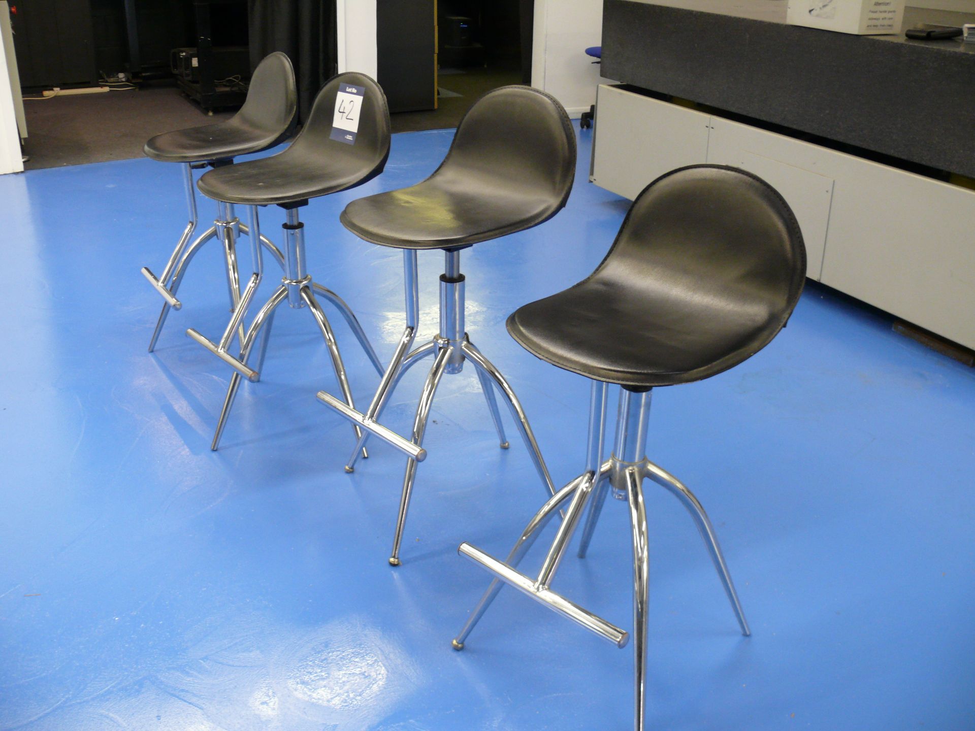 4 chrome framed operators chairs
