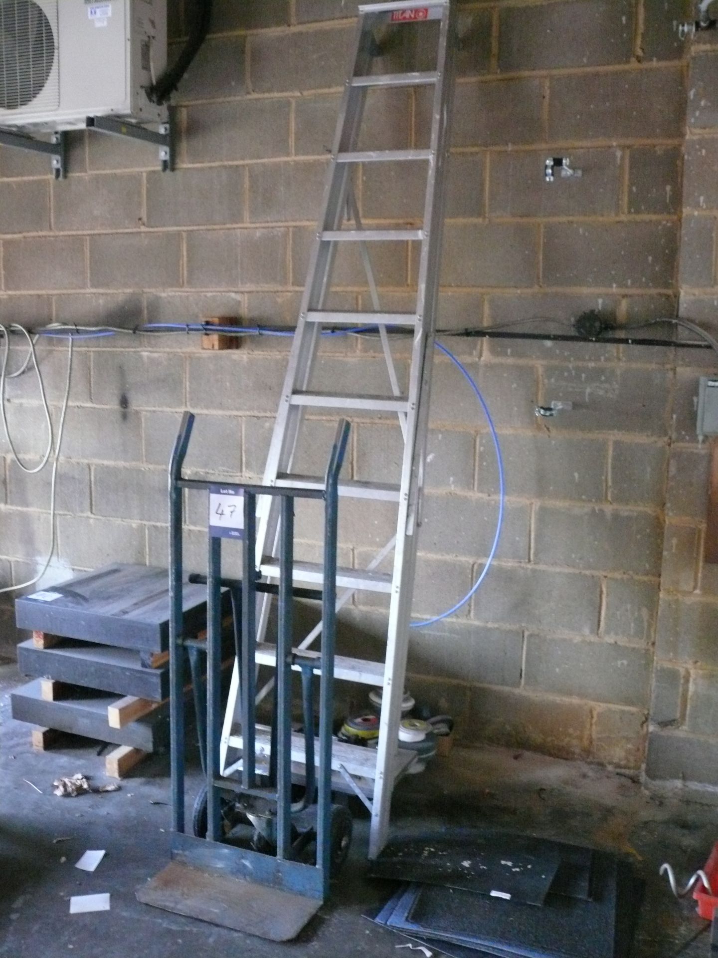 Welded steel sack/platform trolley and a 10 rise aluminium stepladder