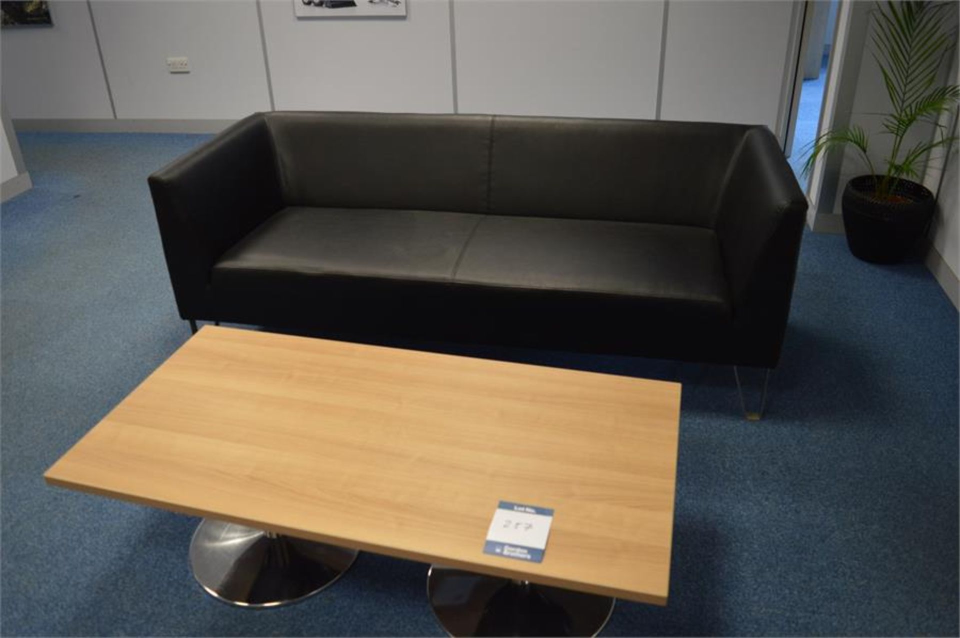 2 x black leather effect sofas with coffee table